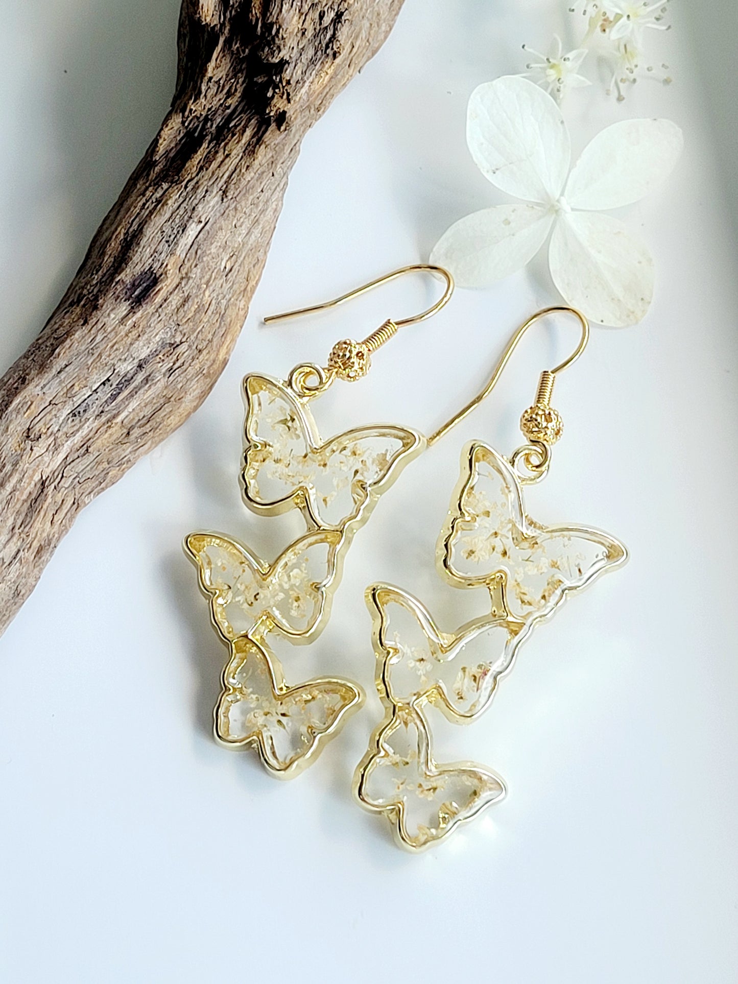 Floral handcrafted butterfly earrings with white wildflowers. Unique Gift. Unique Canadian jewelry