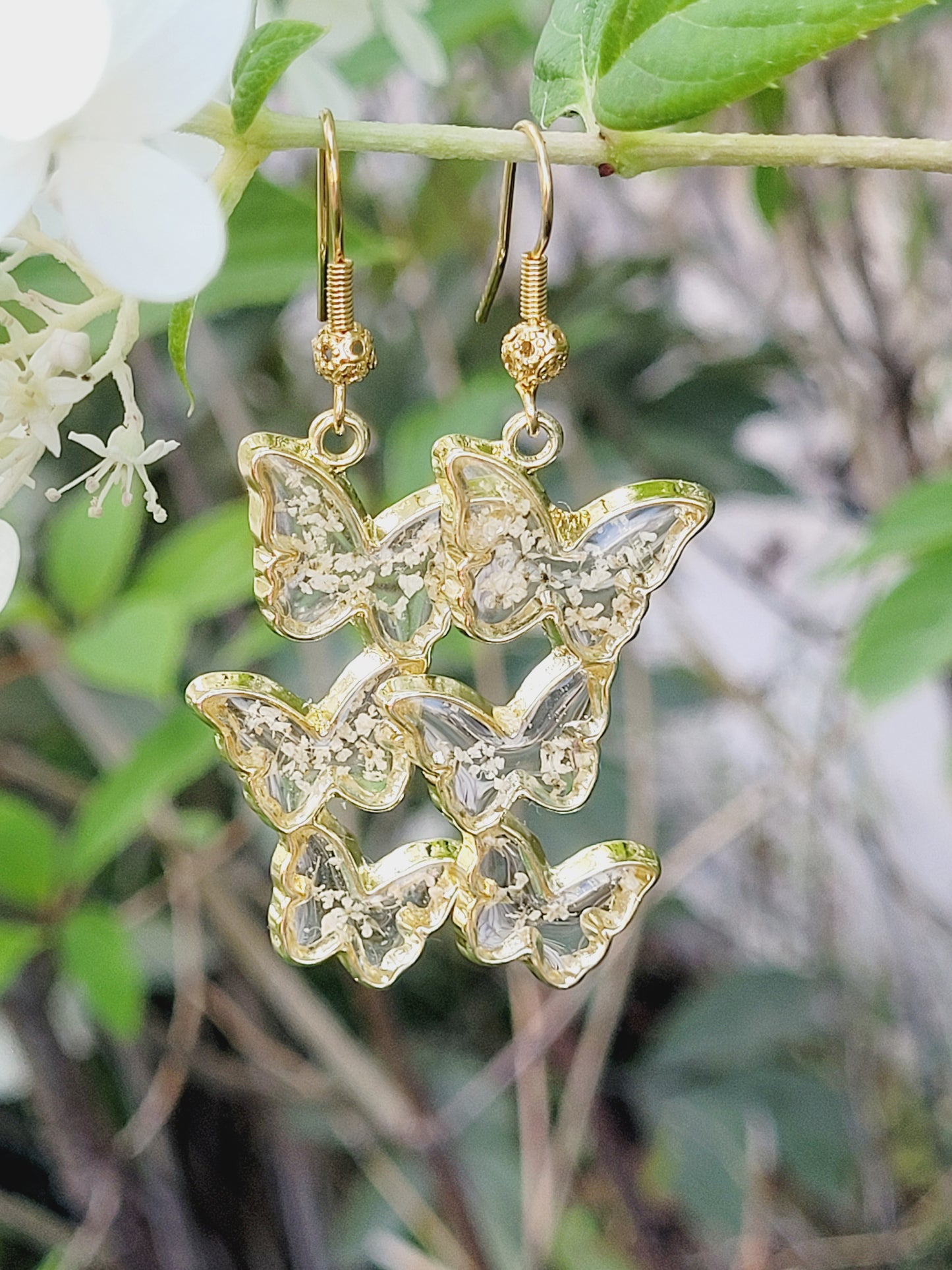Floral handcrafted butterfly earrings with white wildflowers. Unique Gift. Unique Canadian jewelry