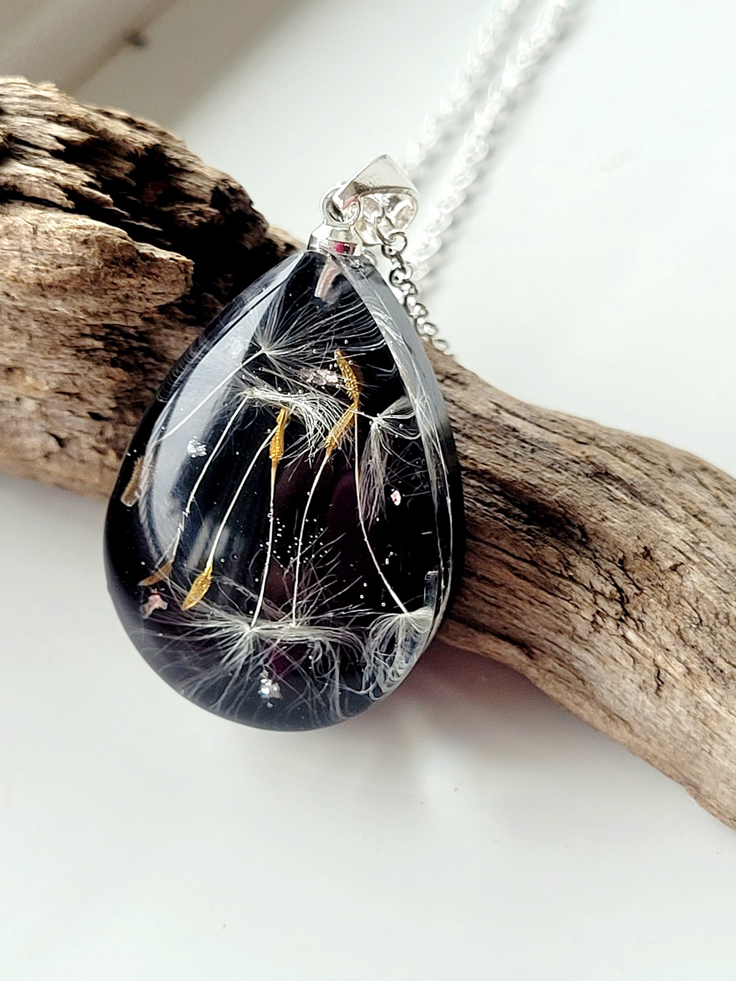 Handmade tear drop dandelion seed necklace. Unique jewelry and gift.