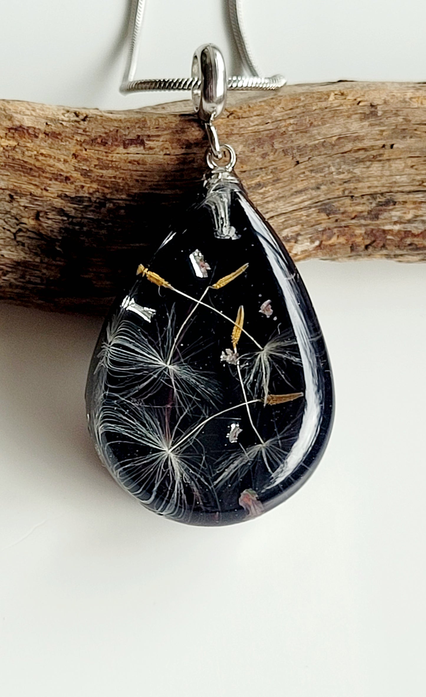 Handmade tear drop dandelion seed necklace. Unique jewelry and gift.