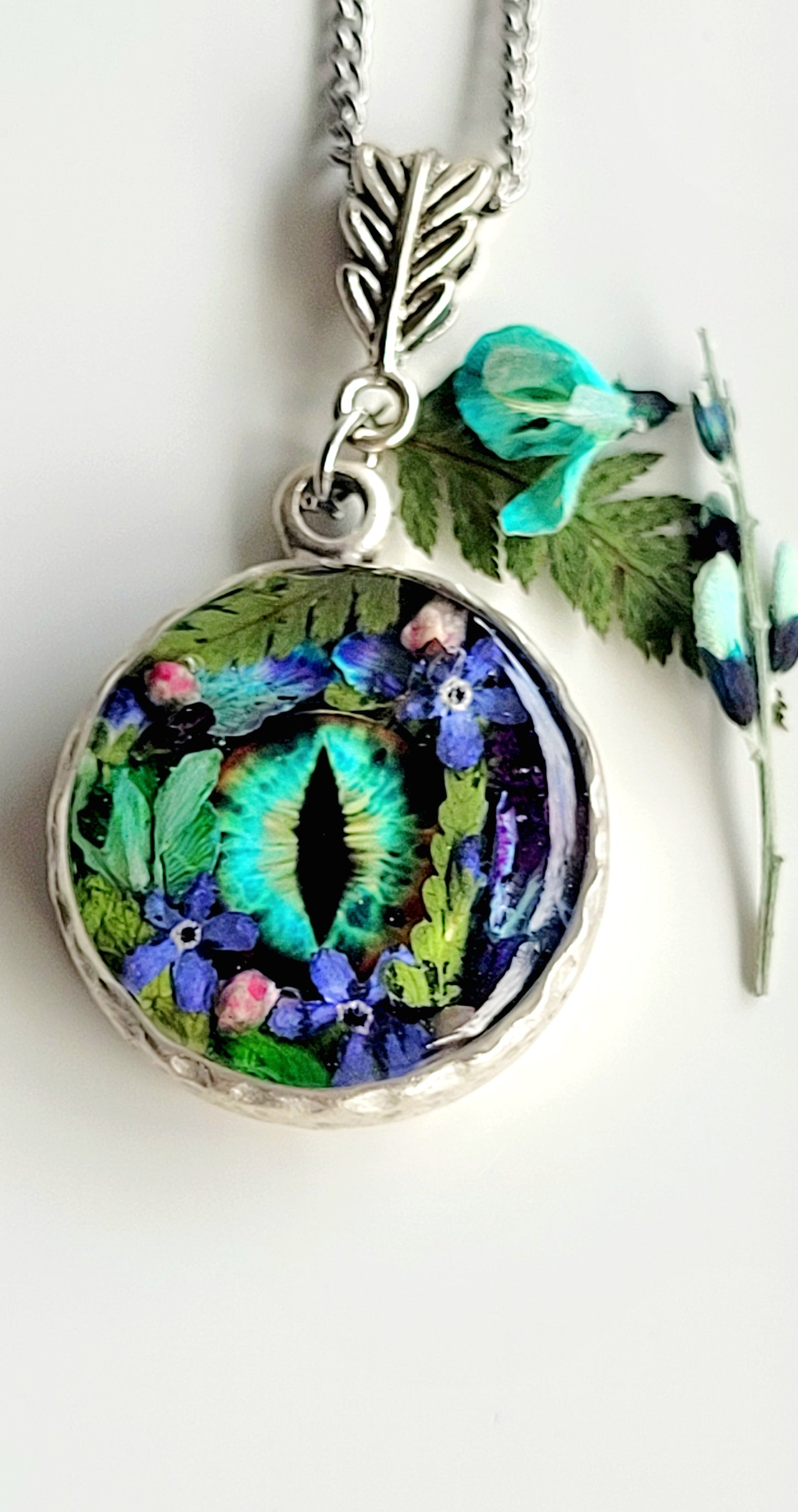 Floral dragon eye framed necklace. Real foget me not flowers. Dragon necklace. Game of thrones