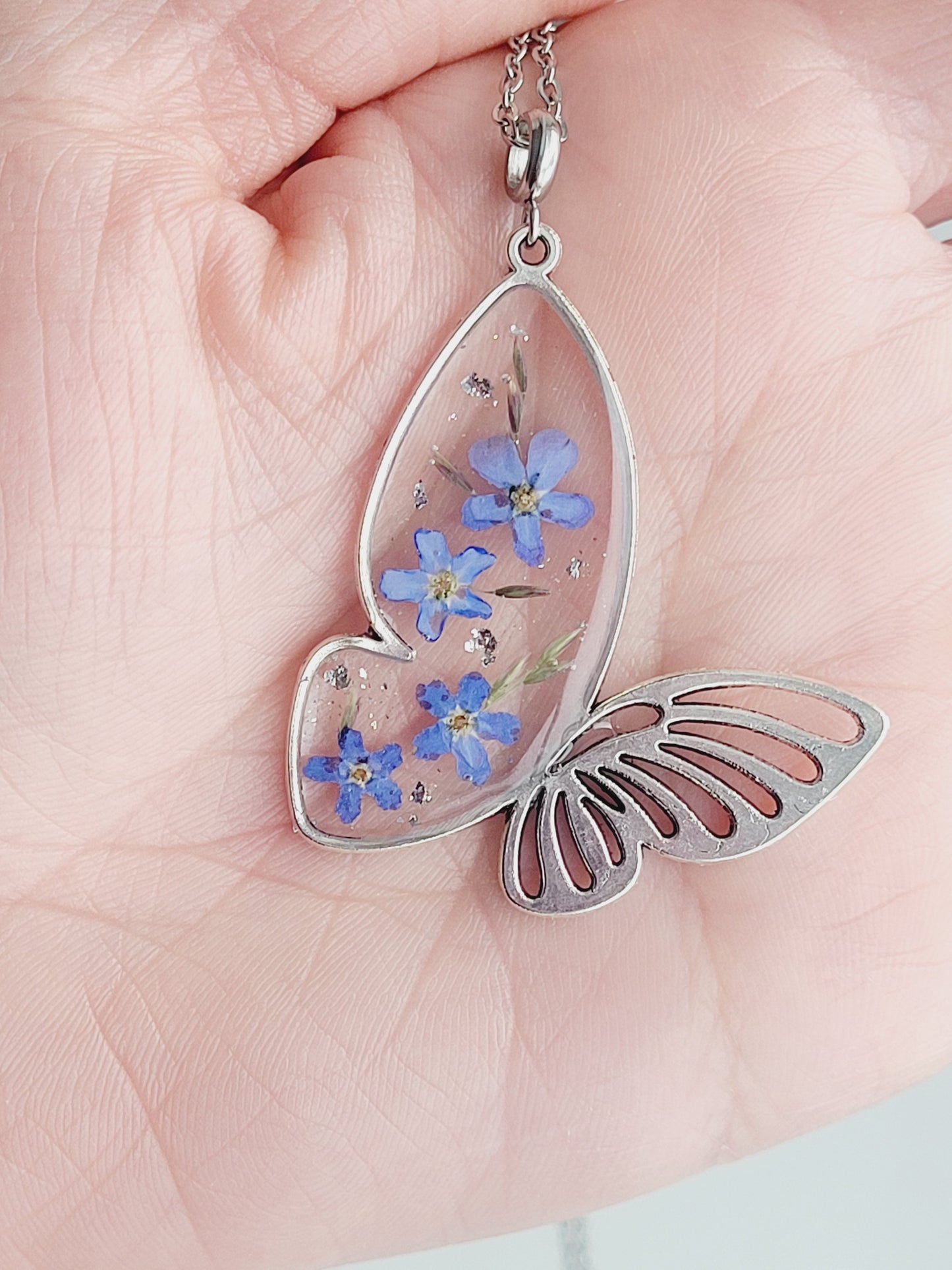 Butterfly necklace with foget me not flowers