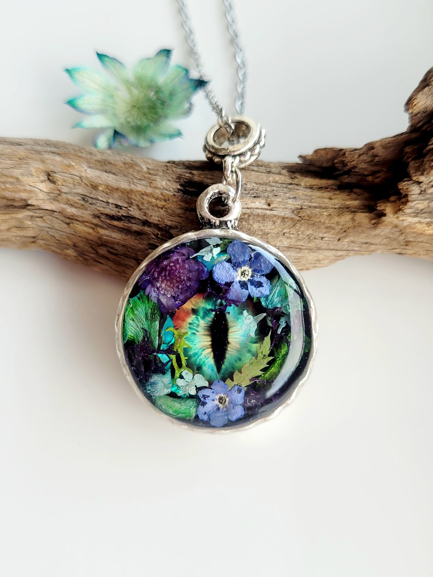Floral dragon eye framed necklace. Real foget me not flowers. Dragon necklace. Game of thrones
