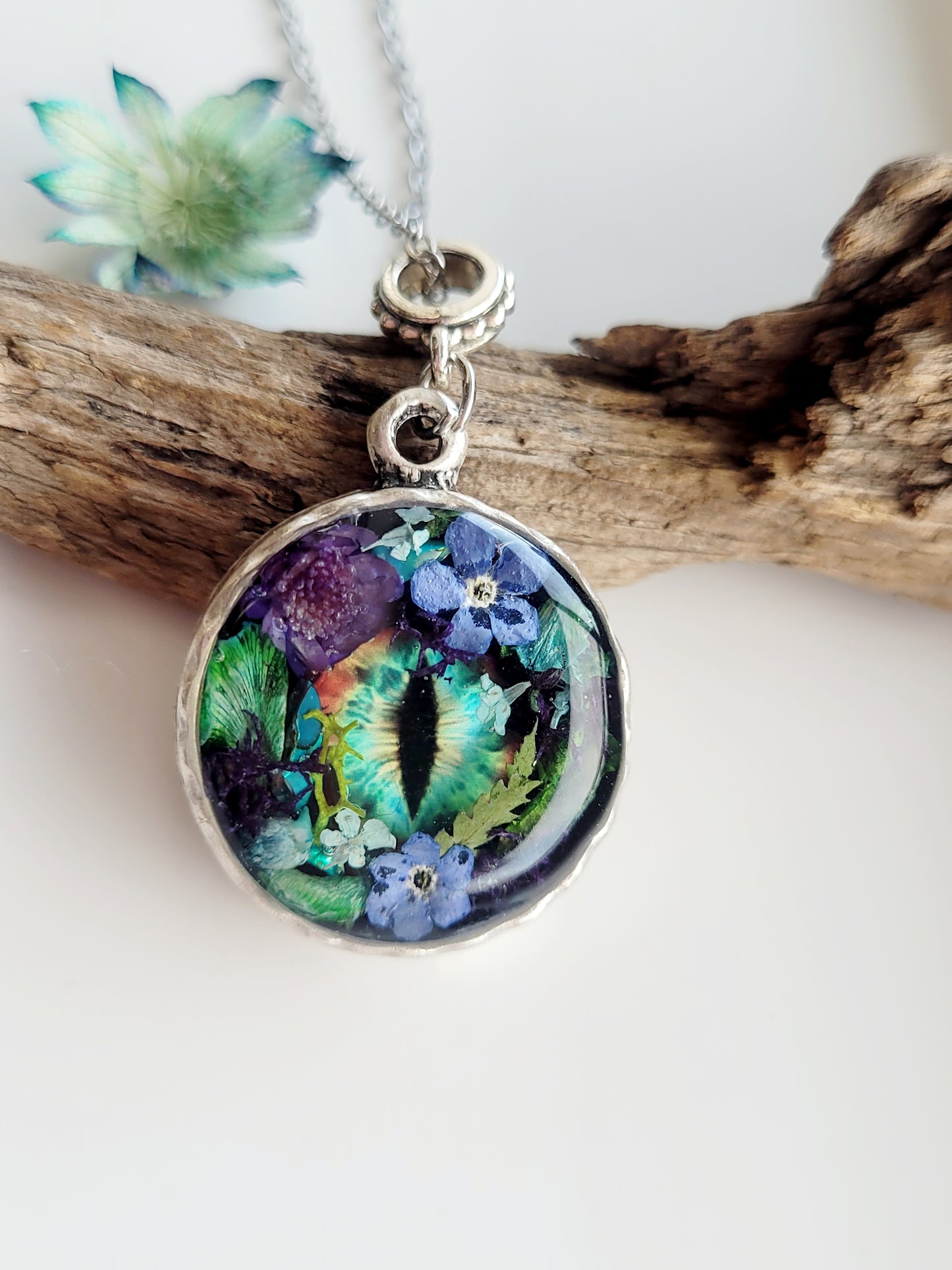 Floral dragon eye framed necklace. Real foget me not flowers. Dragon necklace. Game of thrones