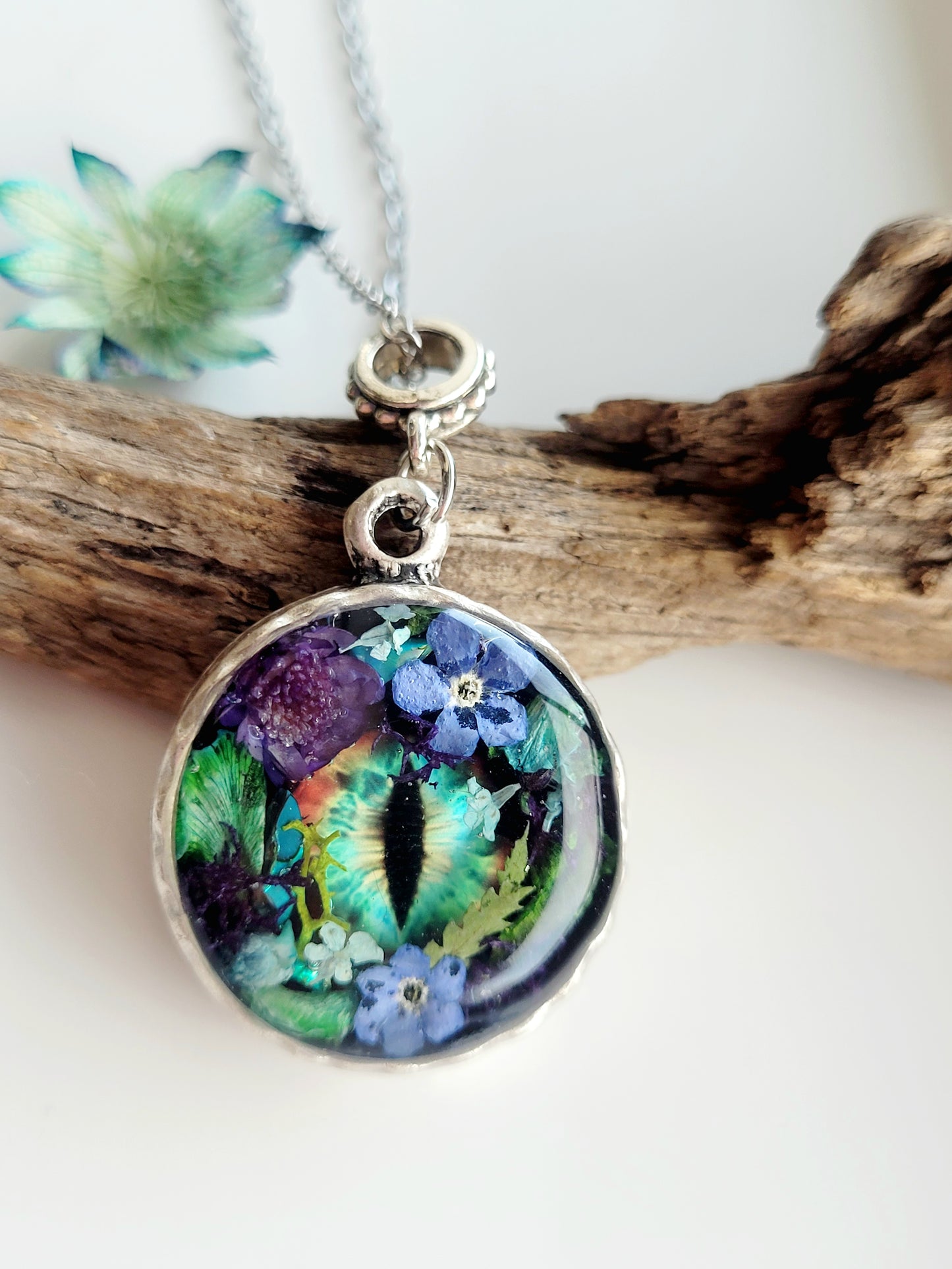 Floral dragon eye framed necklace. Real foget me not flowers. Dragon necklace. Game of thrones