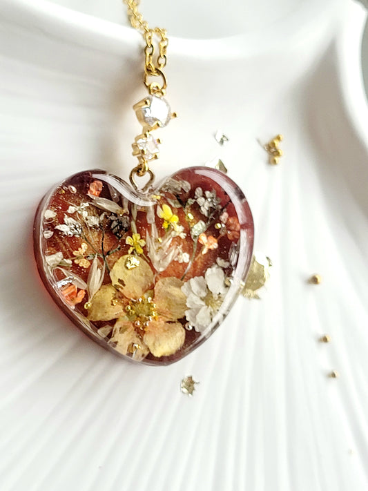 Amber like floral botanical handcrafted heart necklace with genuine flowers