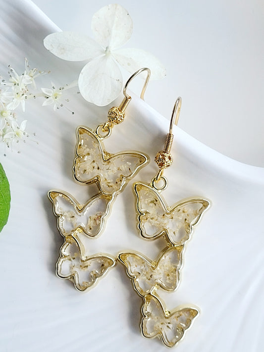 Floral handcrafted butterfly earrings with white wildflowers. Unique Gift. Unique Canadian jewelry