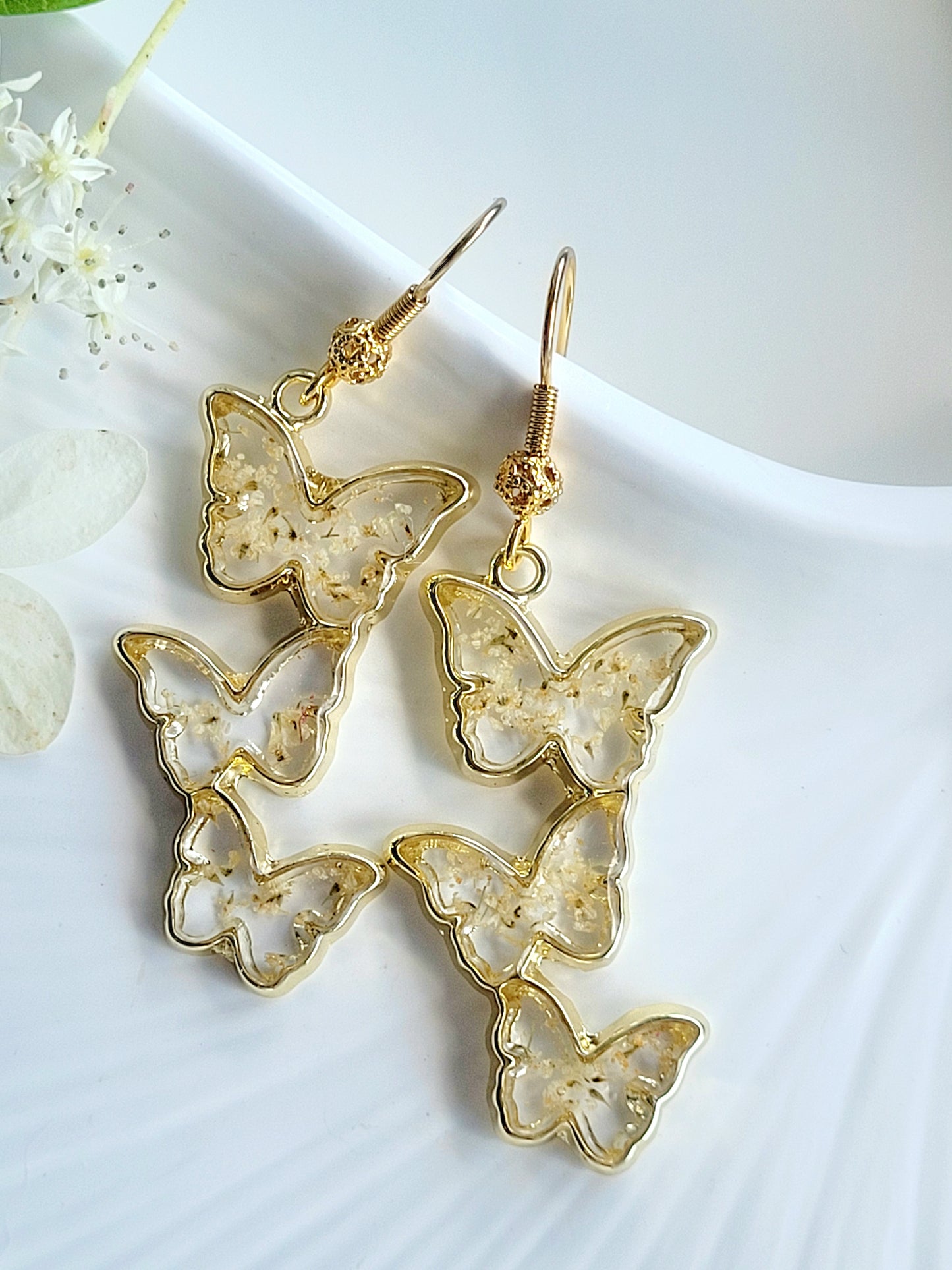 Floral handcrafted butterfly earrings with white wildflowers. Unique Gift. Unique Canadian jewelry