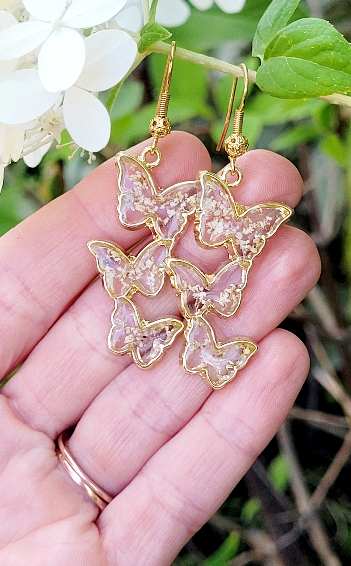Floral handcrafted butterfly earrings with white wildflowers. Unique Gift. Unique Canadian jewelry