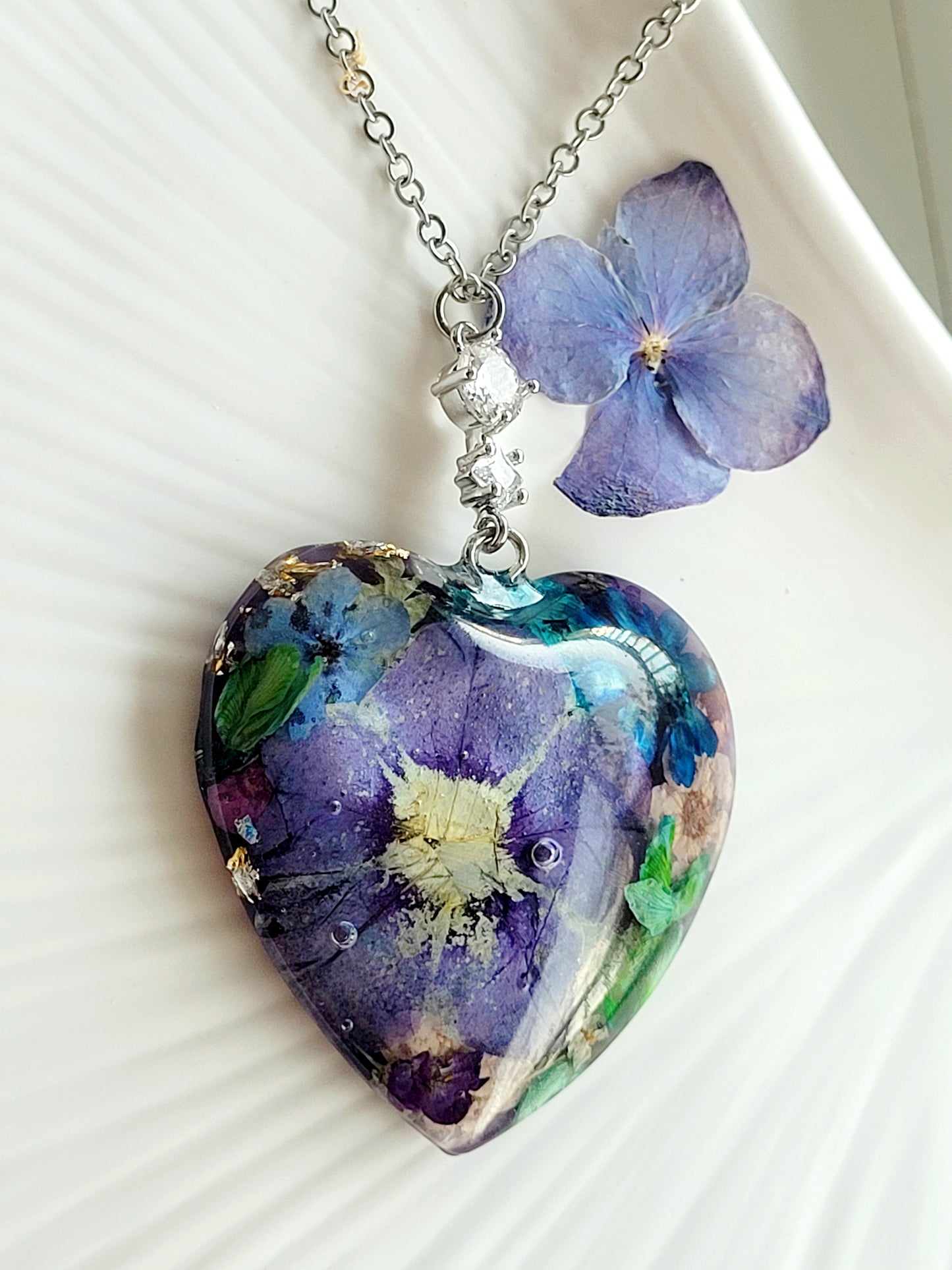 Floral botanical handcrafted heart necklace with genuine petunia flower