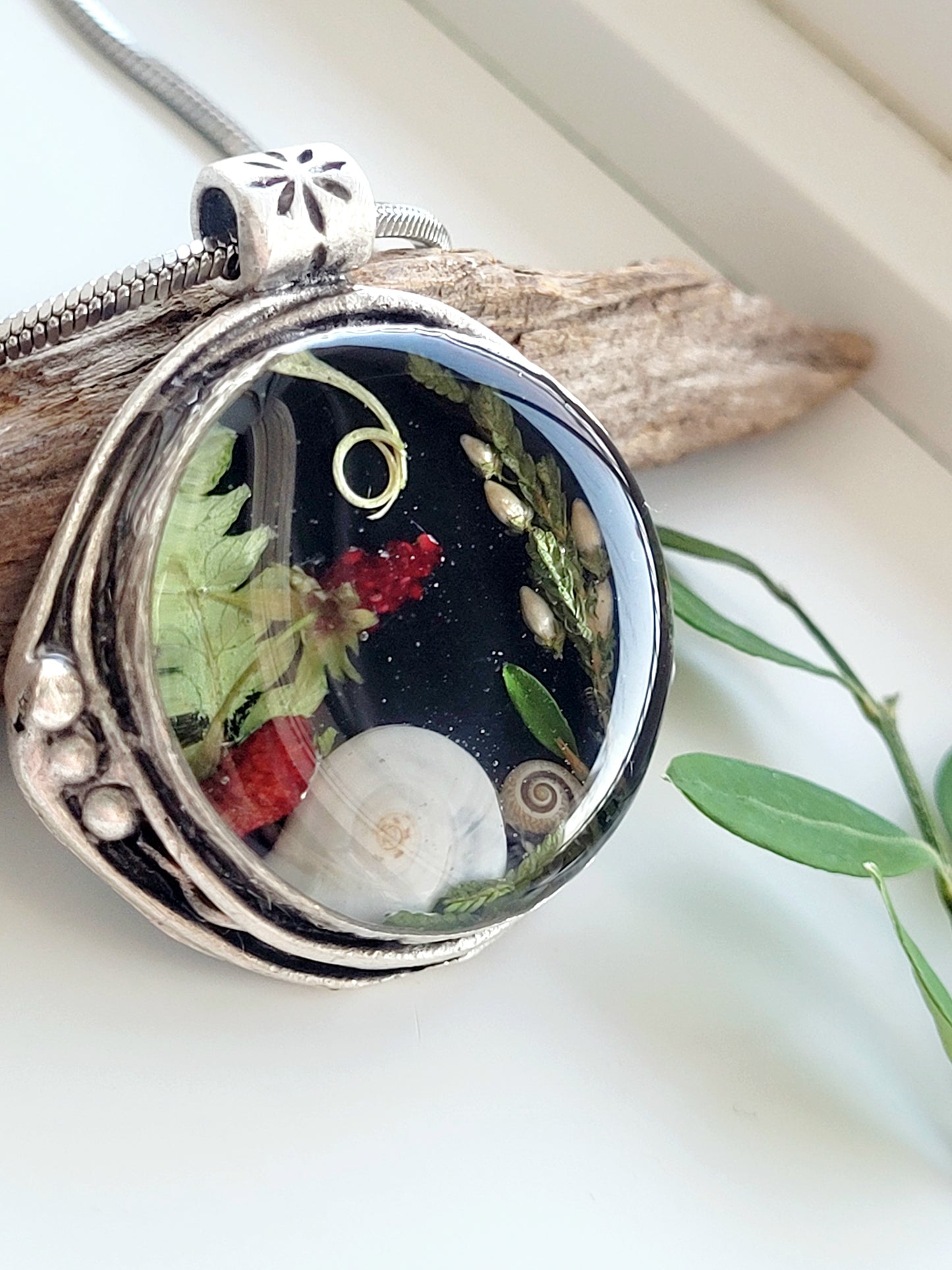 Round botanical handcrafted wld strawberry necklace.