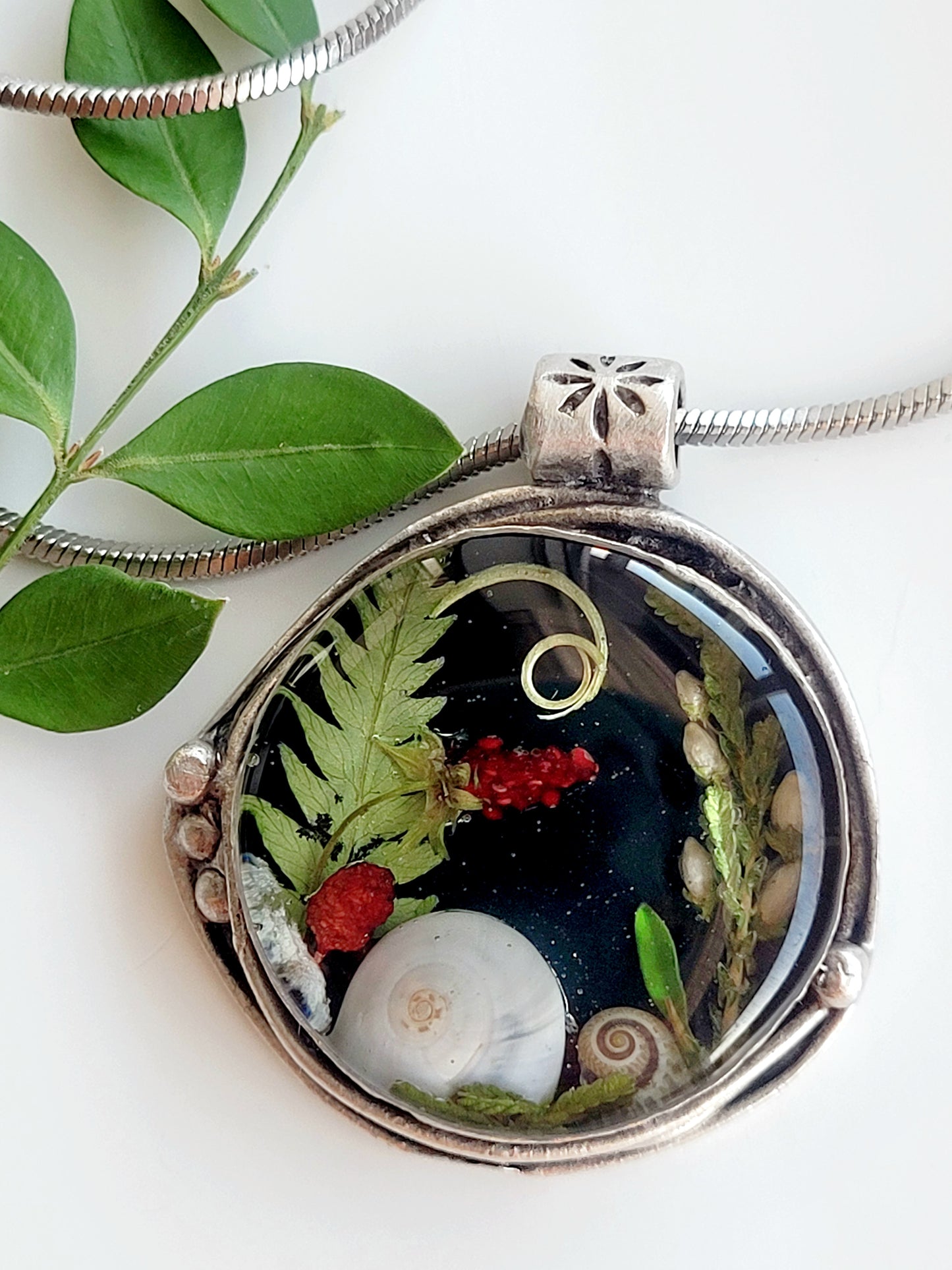 Round botanical handcrafted wld strawberry necklace.