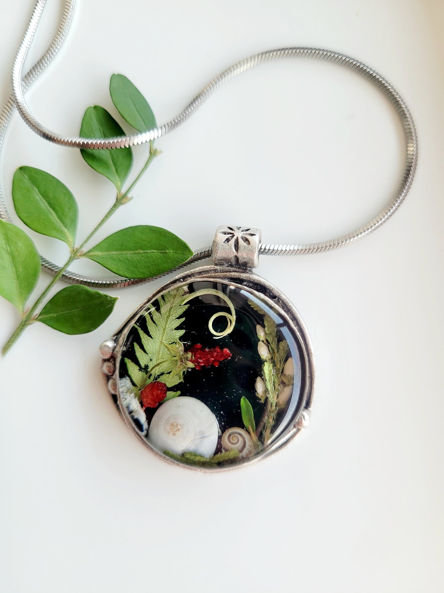 Round botanical handcrafted wld strawberry necklace.
