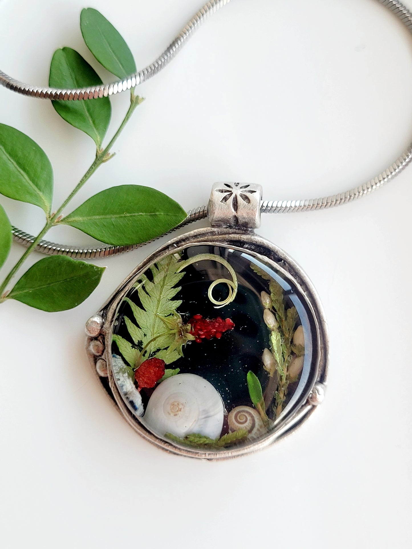 Round botanical handcrafted wld strawberry necklace.