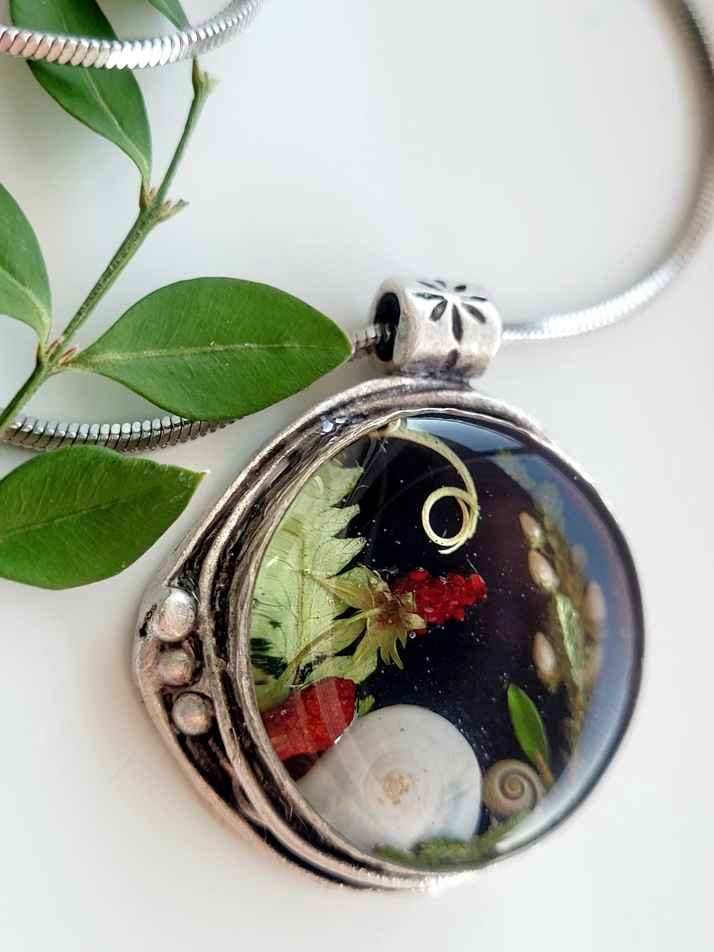 Round botanical handcrafted wld strawberry necklace.