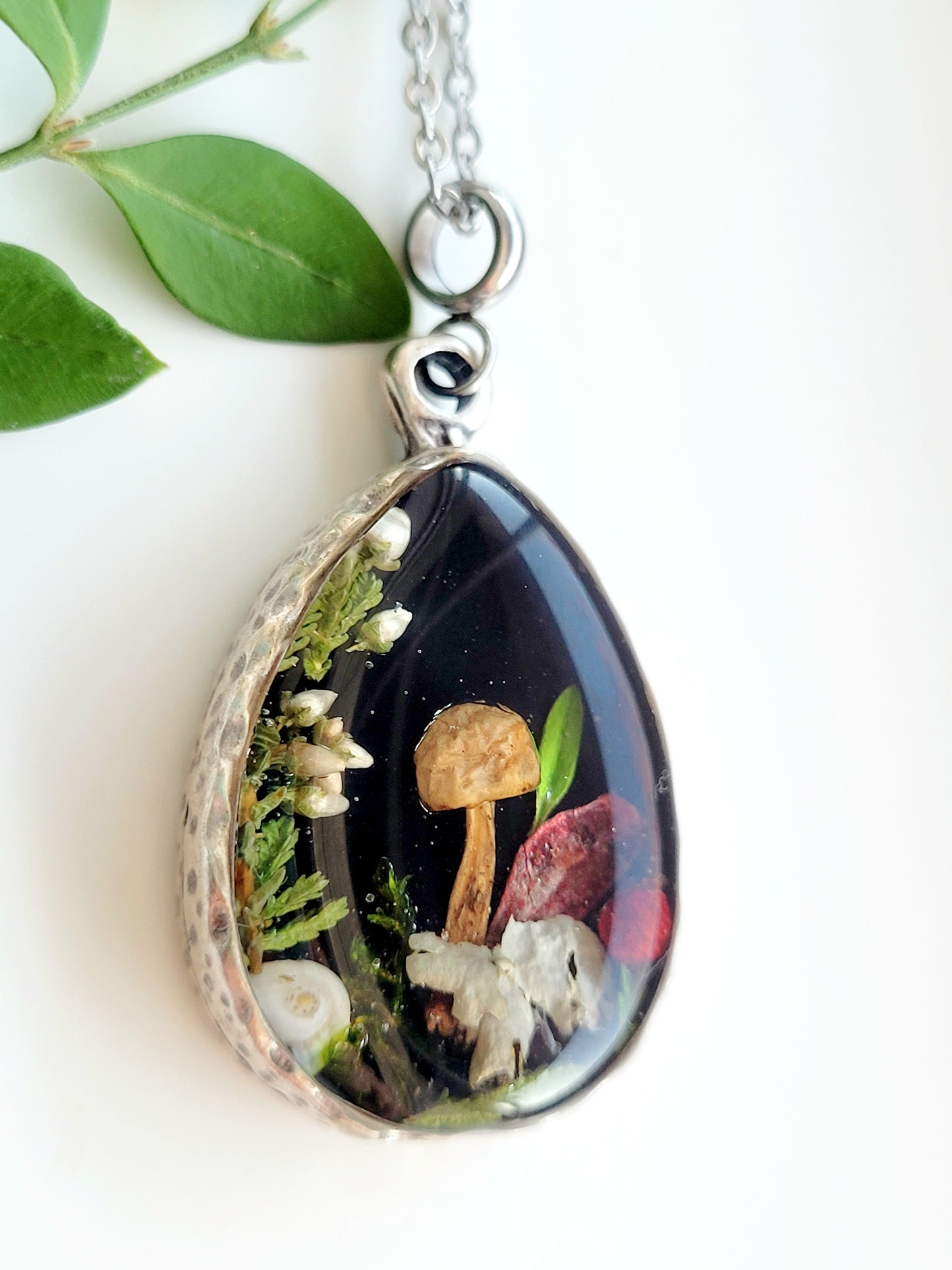 Botanical handcrafted teardrop mushroom necklace.