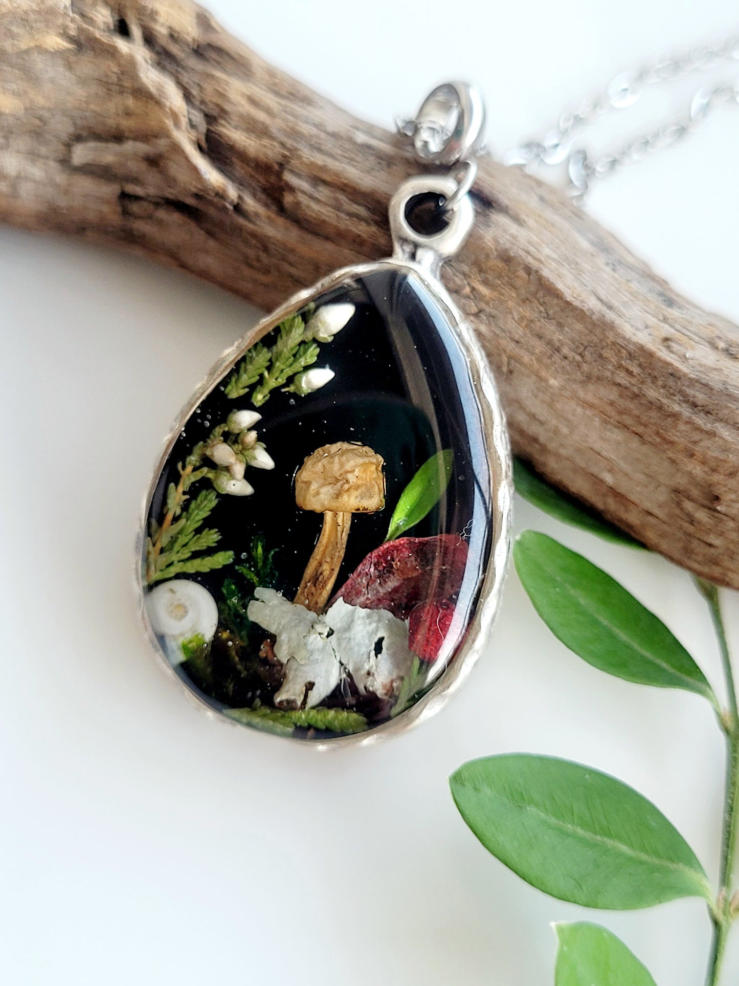 Botanical handcrafted teardrop mushroom necklace.