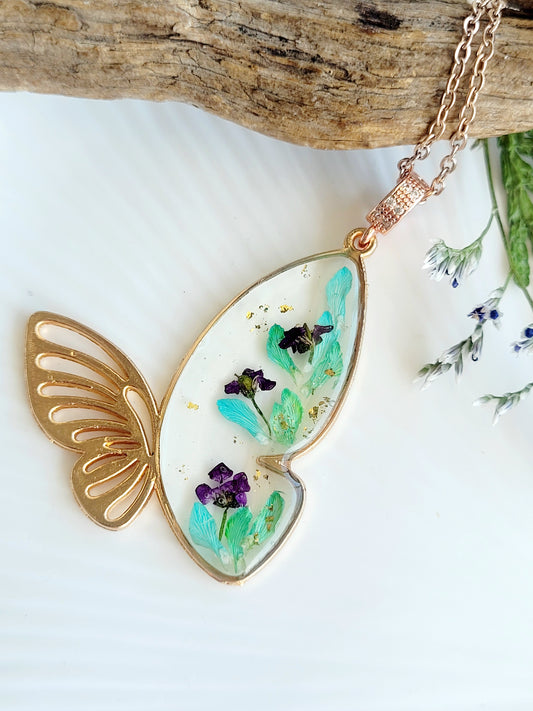 Botanical, handcrafted butterfly necklace with genuine teal genista flowers. Unique gift
