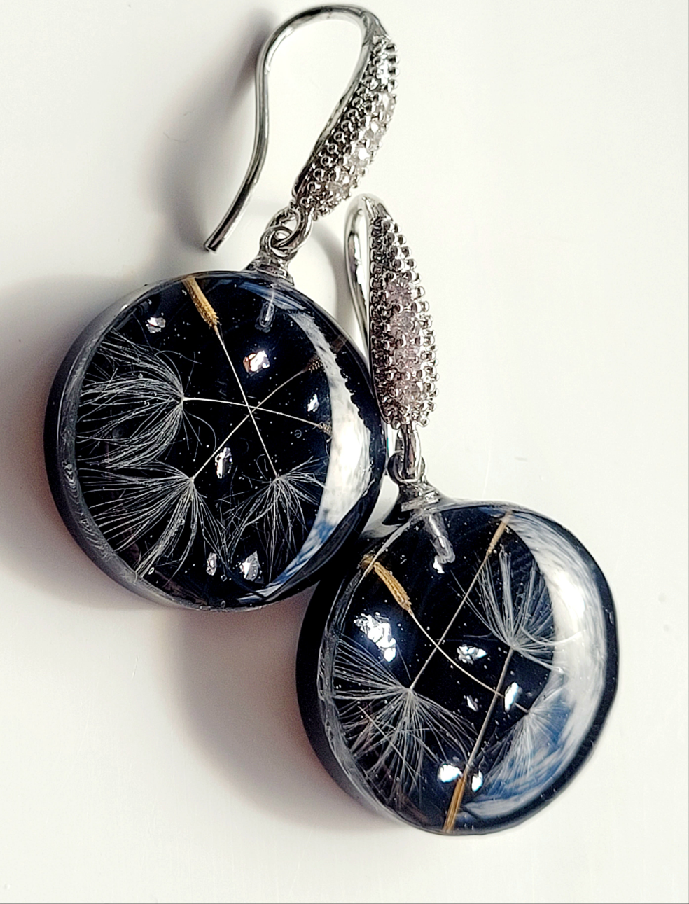 Round dandelion seed earrings. Handcrafted earrings with dandelion seeds. Elegant ad stylish light handmade earrings