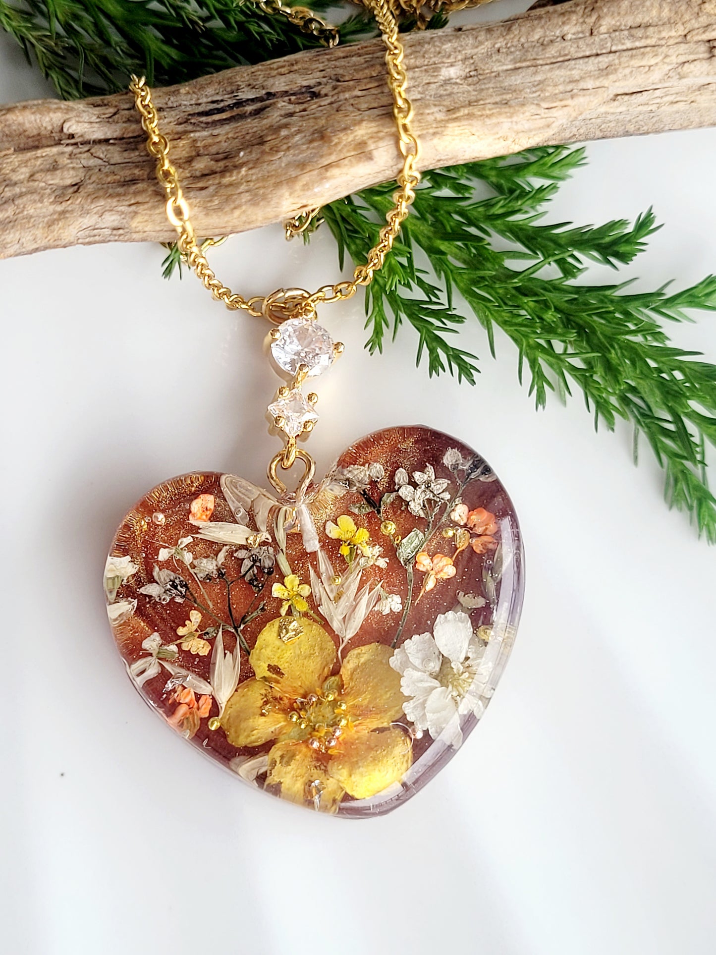 Amber like floral botanical handcrafted heart necklace with genuine flowers