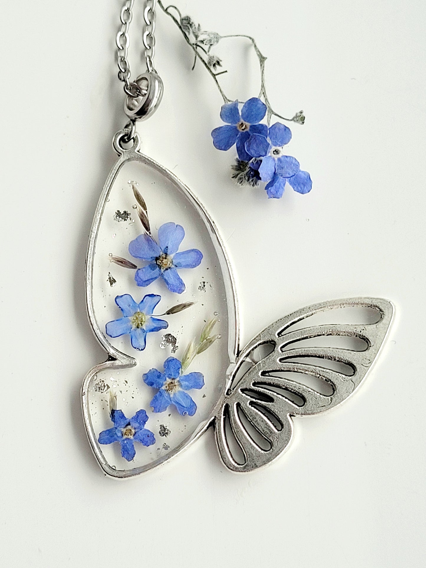 Butterfly necklace with foget me not flowers