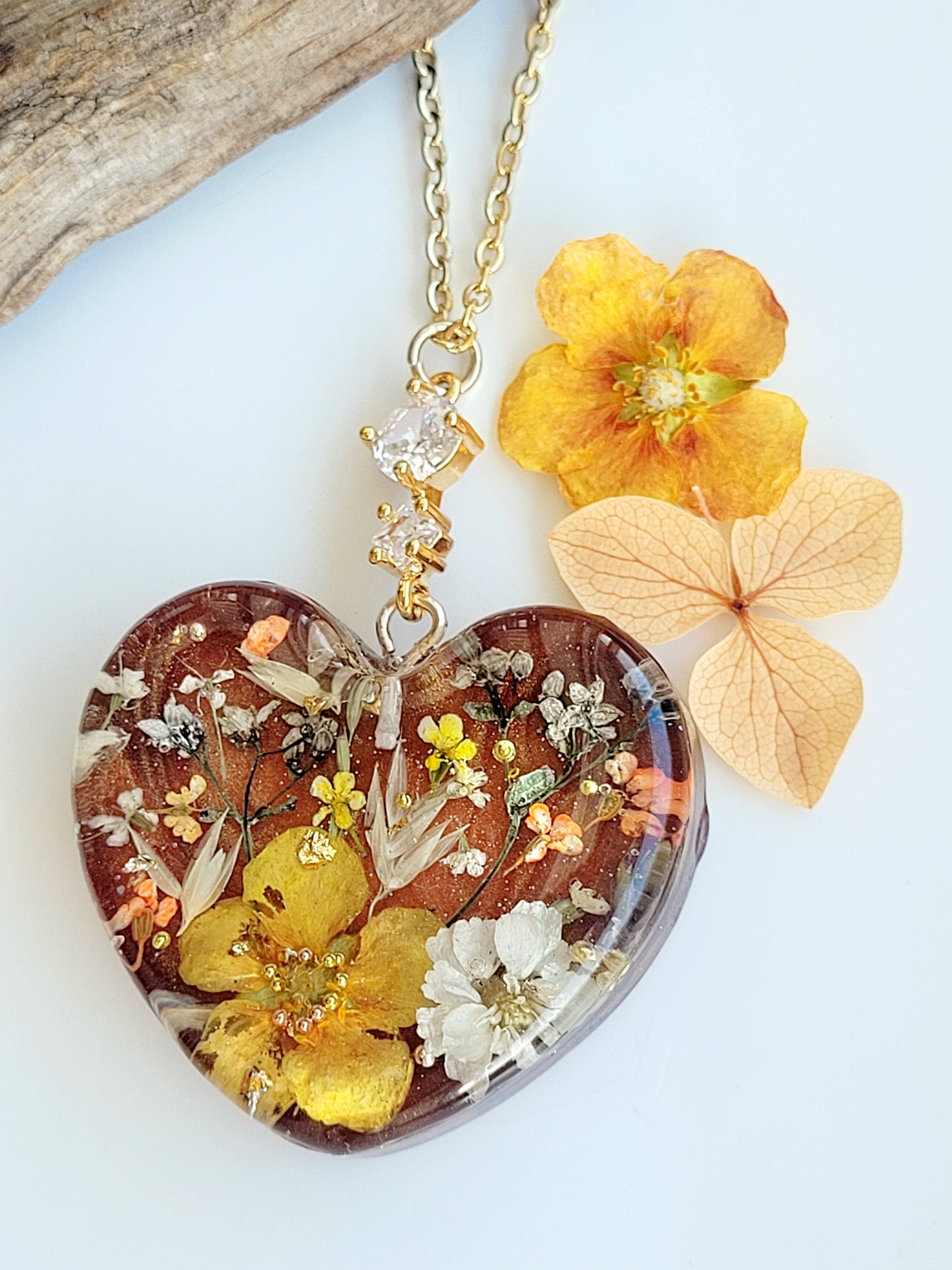 Amber like floral botanical handcrafted heart necklace with genuine flowers