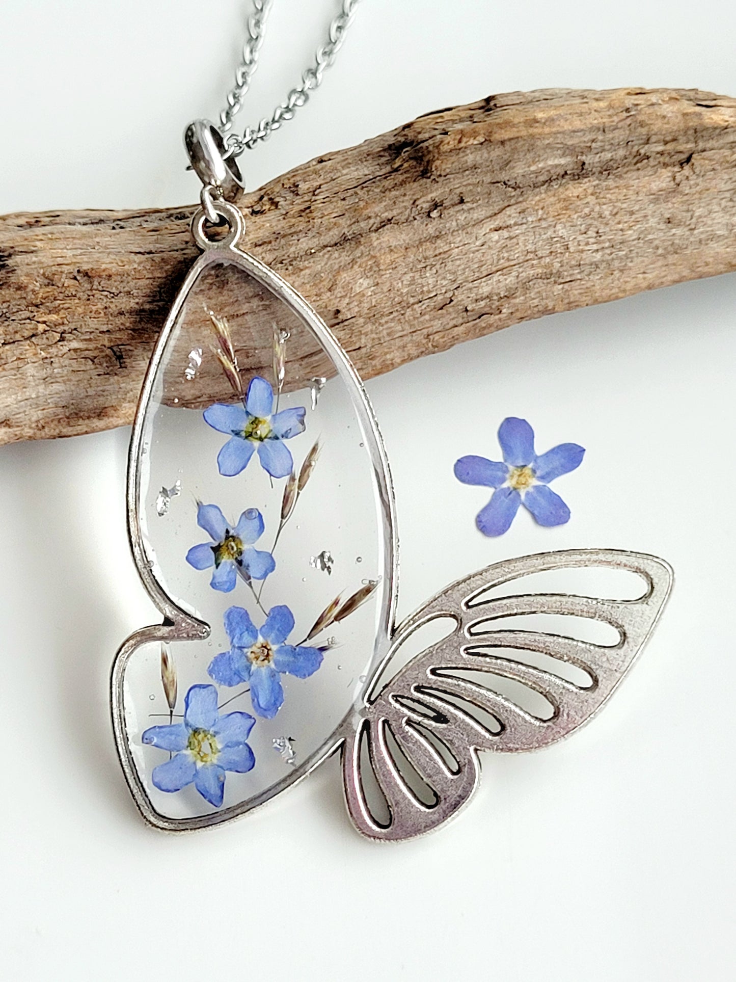 Butterfly necklace with foget me not flowers