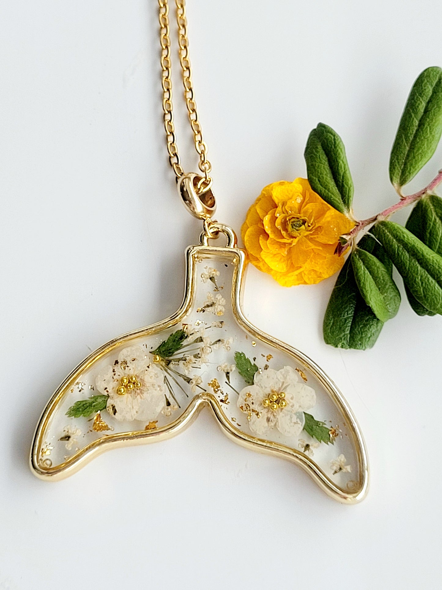 Floral whale tail necklace with genuine flowers