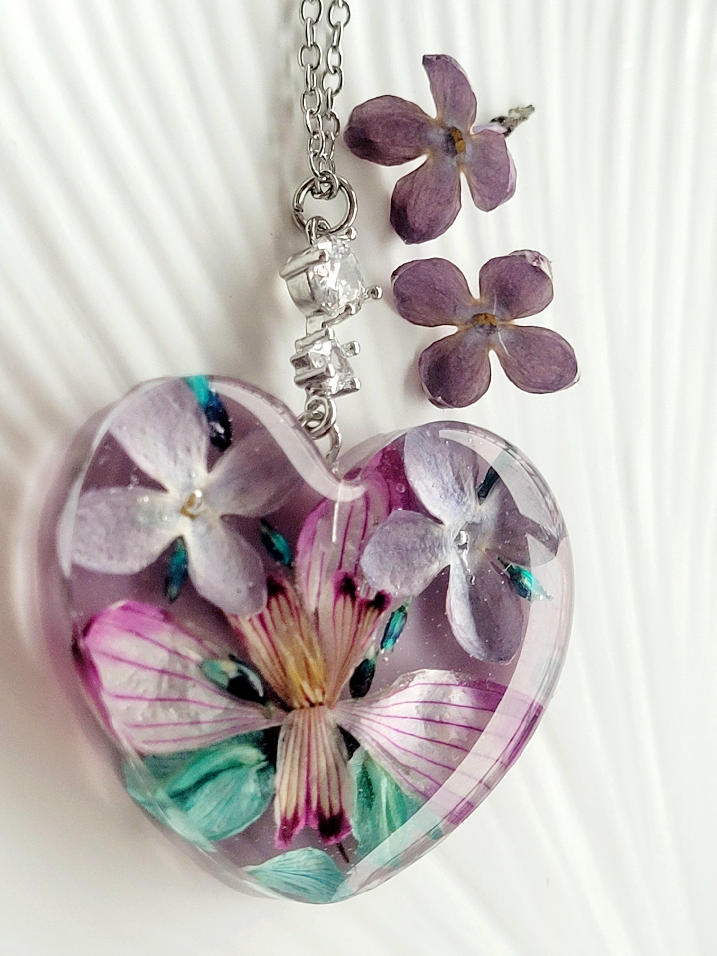 Floral handcrafted heart necklace with genuine snowdrop and lilac flowers