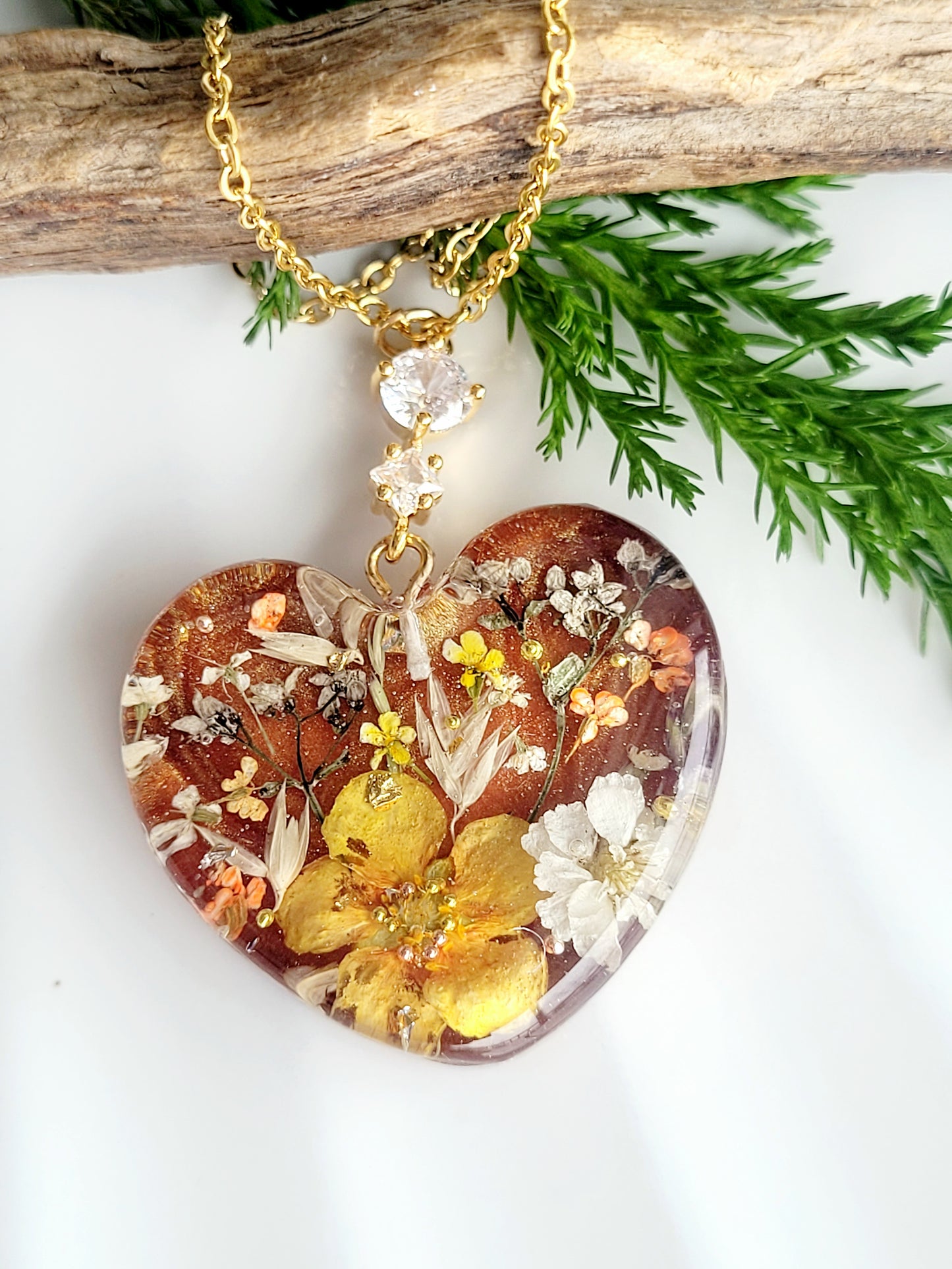 Amber like floral botanical handcrafted heart necklace with genuine flowers