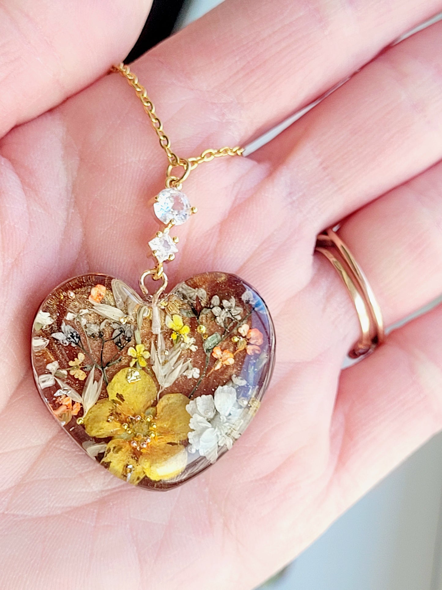 Amber like floral botanical handcrafted heart necklace with genuine flowers