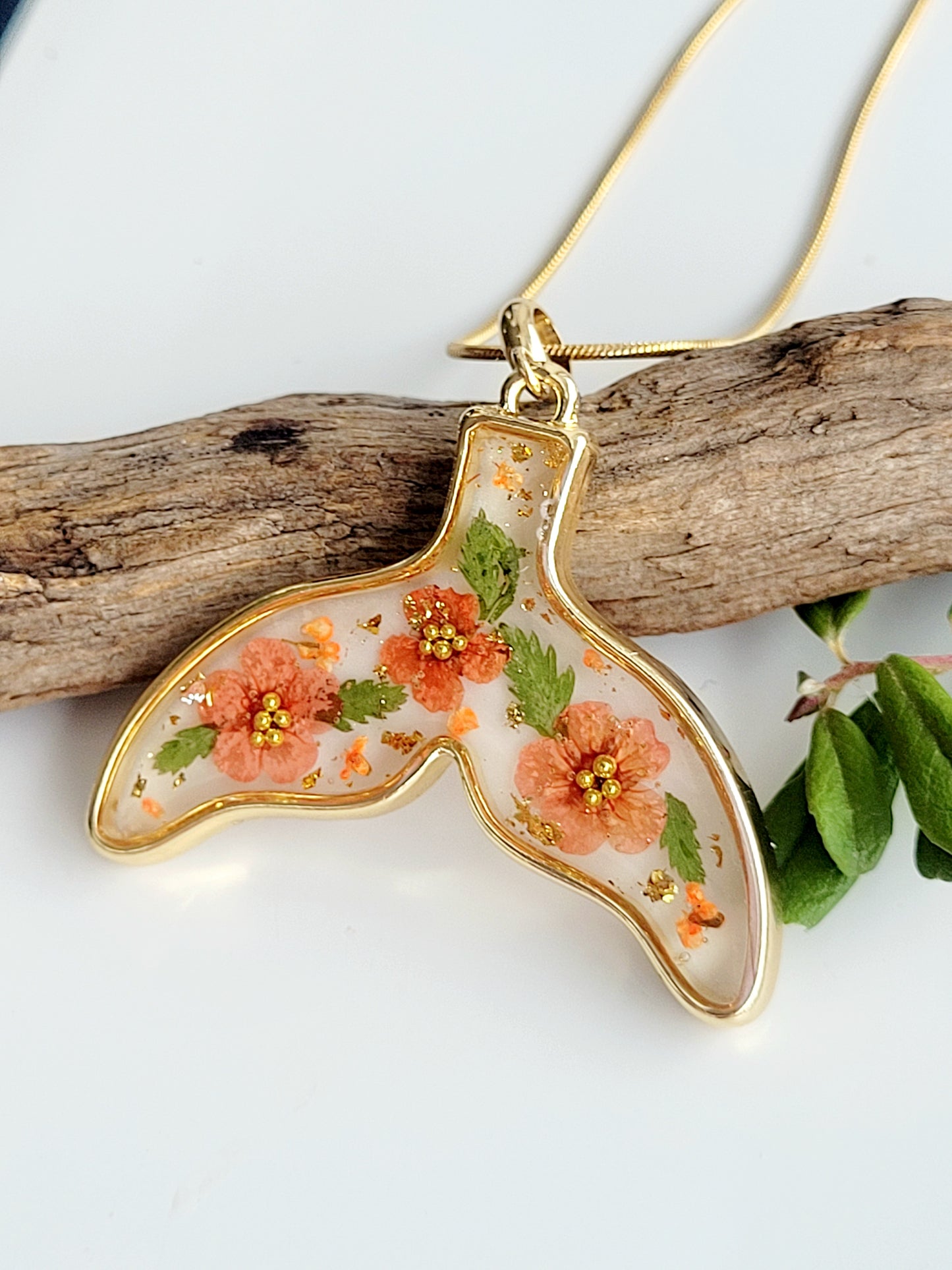 Botanical handcrafted whale tail necklace with genuine flowers