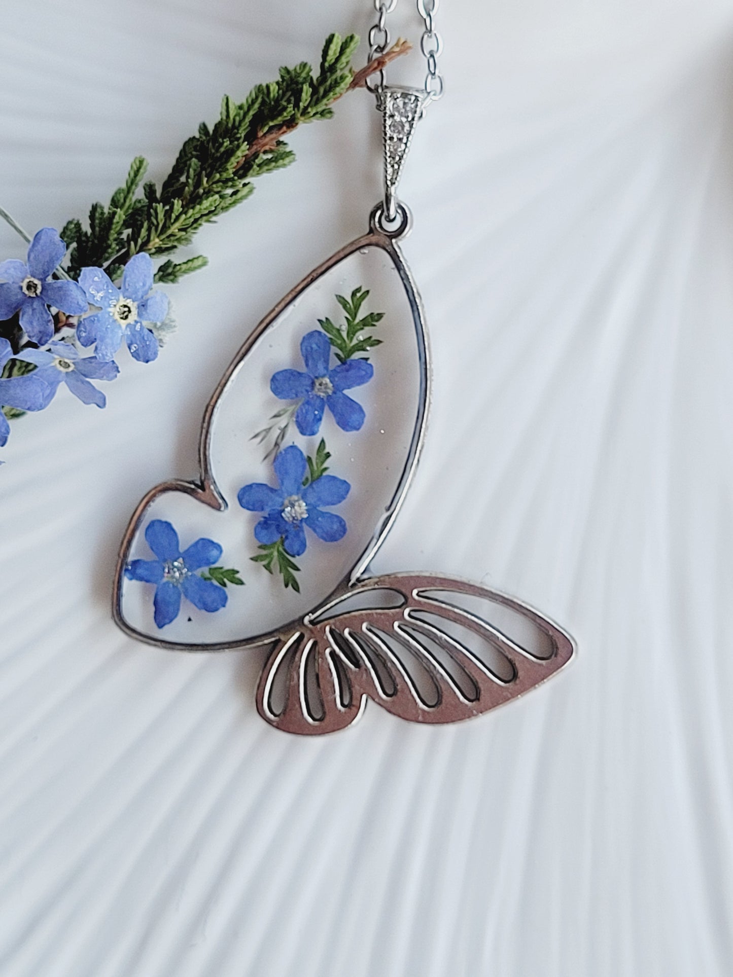 Butterfly necklace with foget me not flowers