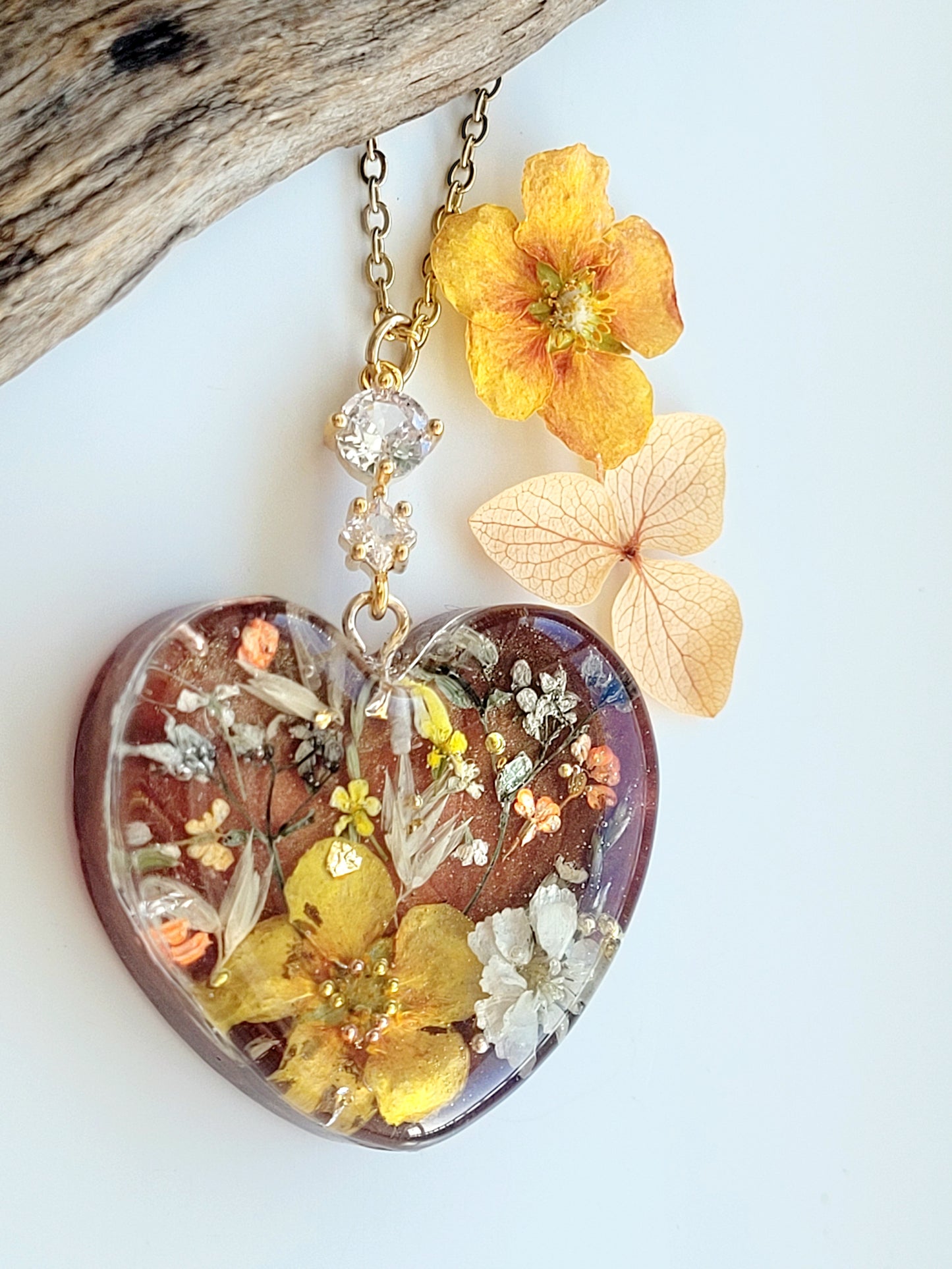 Amber like floral botanical handcrafted heart necklace with genuine flowers