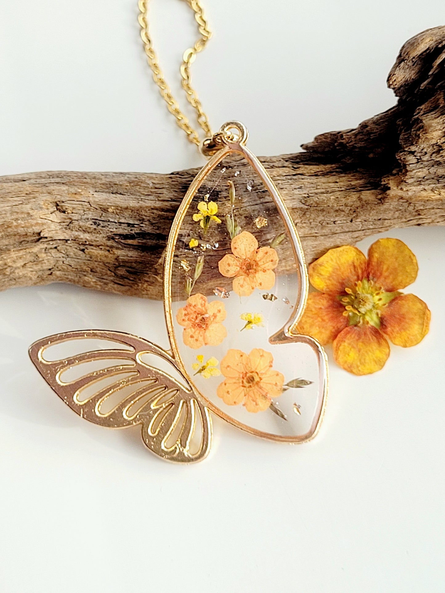 Botanical, handcrafted orange butterfly necklac with genuine flowers. Unique gift