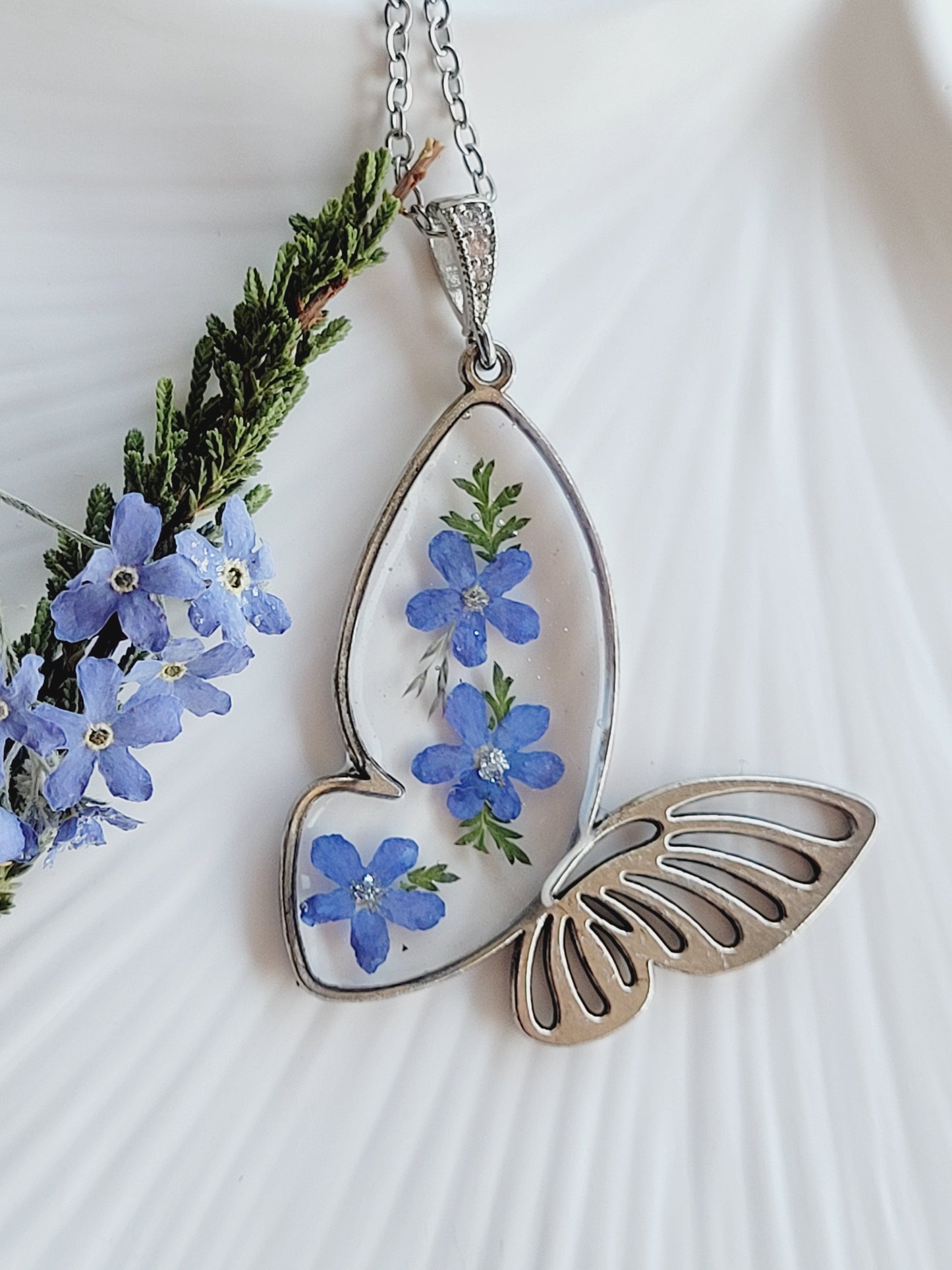 Butterfly necklace with foget me not flowers