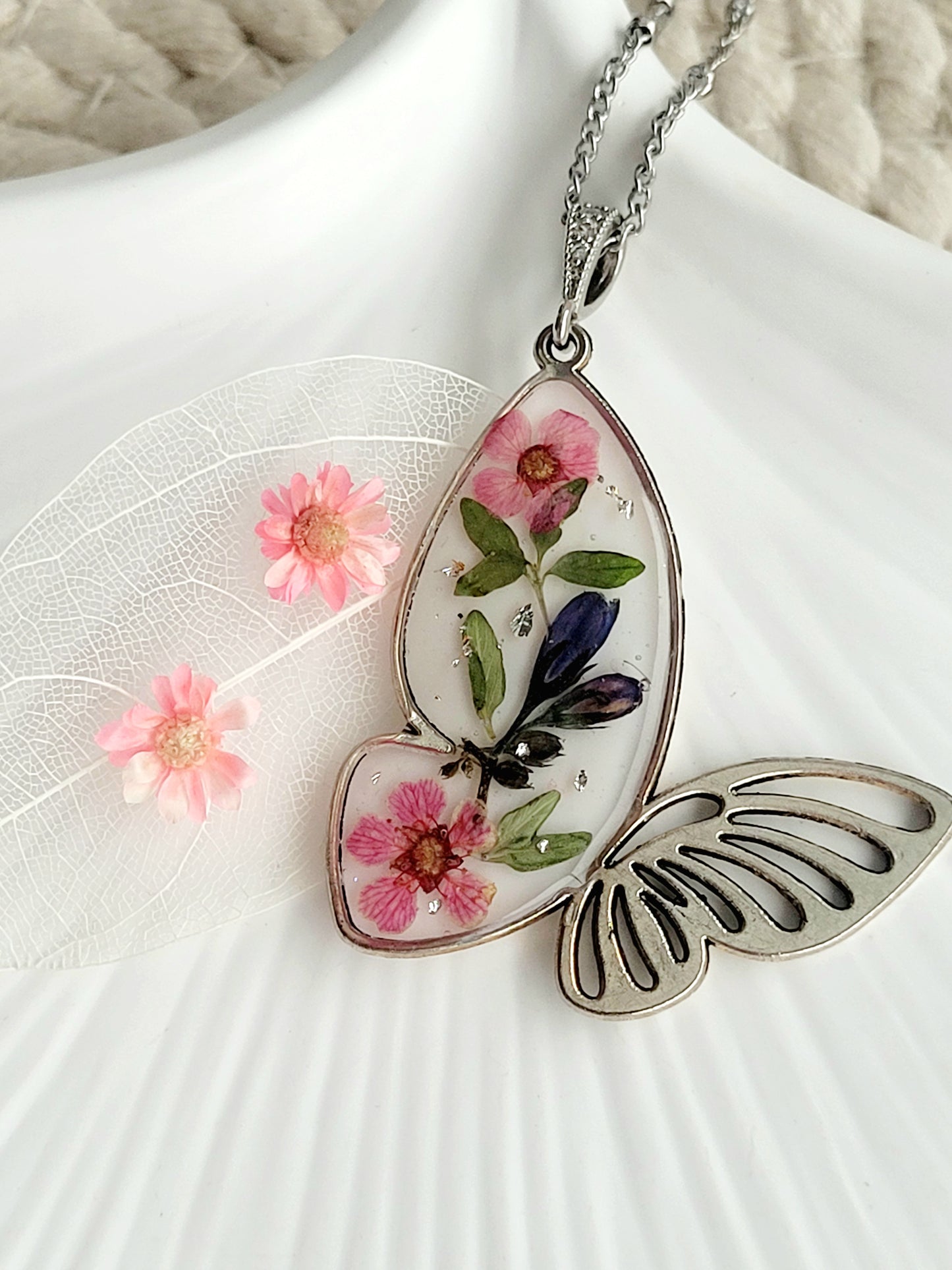 Botanical, handcrafted butterfly necklace with genuine blue bell and wildflowers. Unique gift