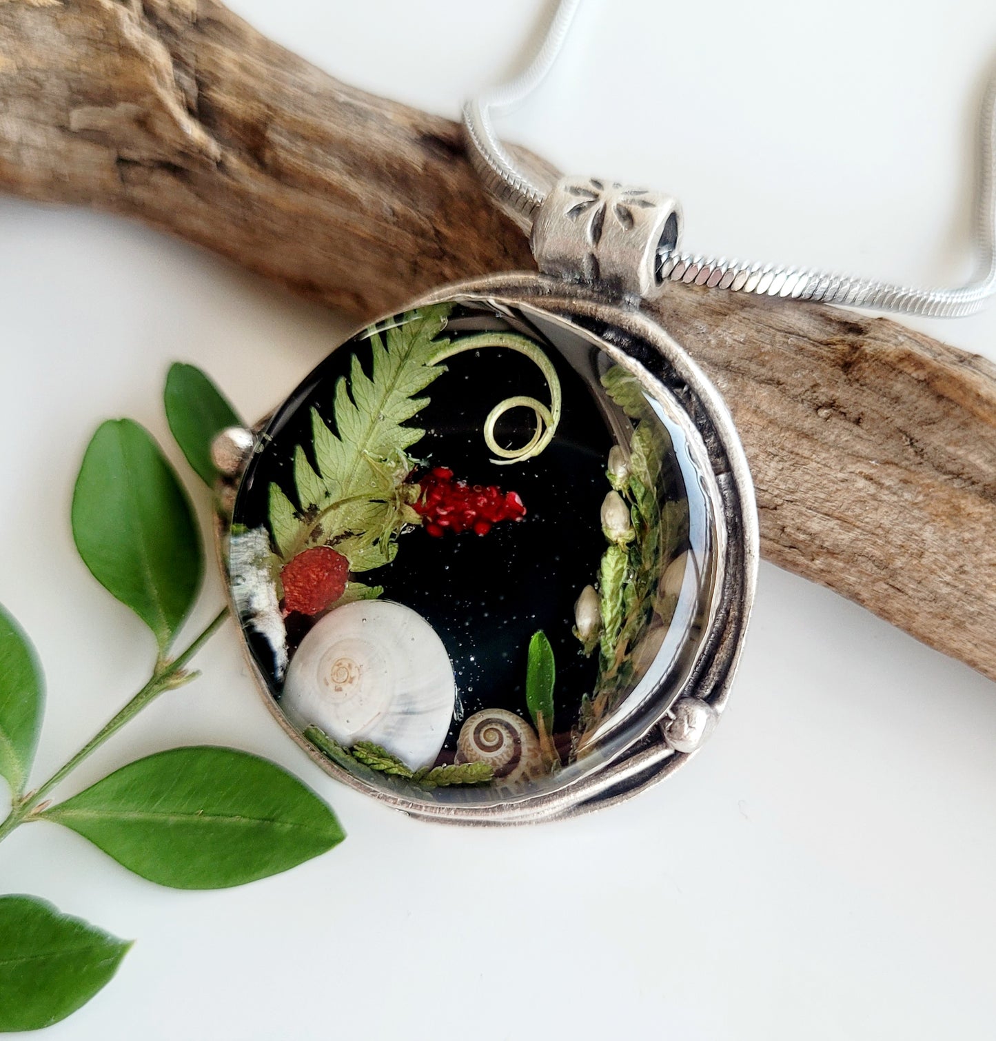 Round botanical handcrafted wld strawberry necklace.