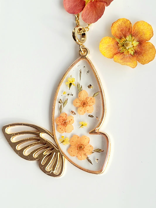 Botanical, handcrafted orange butterfly necklac with genuine flowers. Unique gift