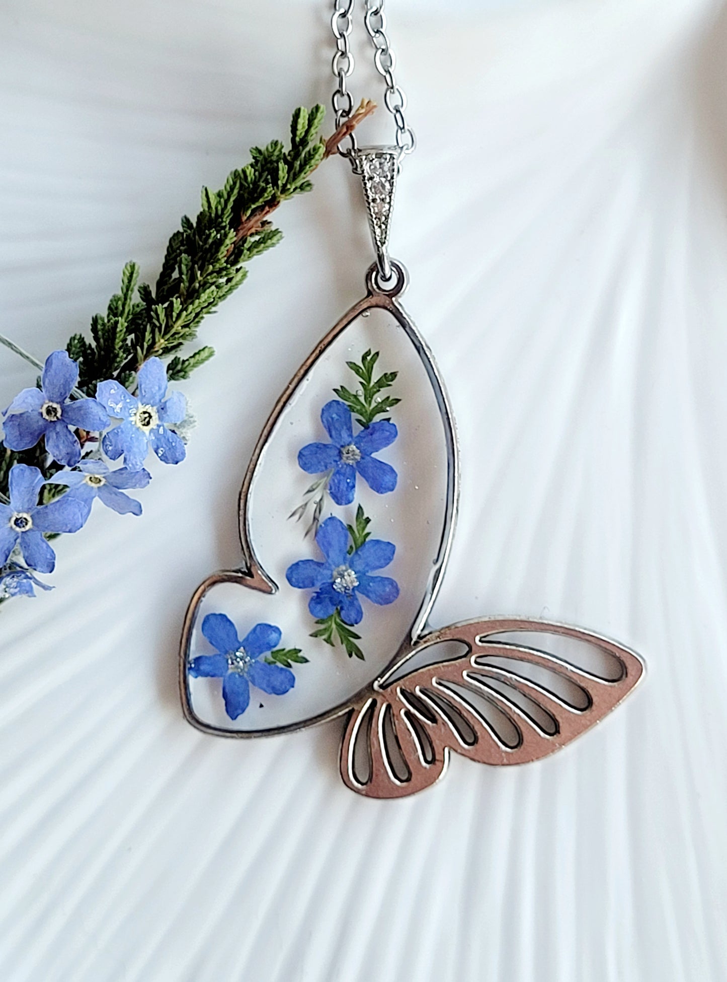 Butterfly necklace with foget me not flowers