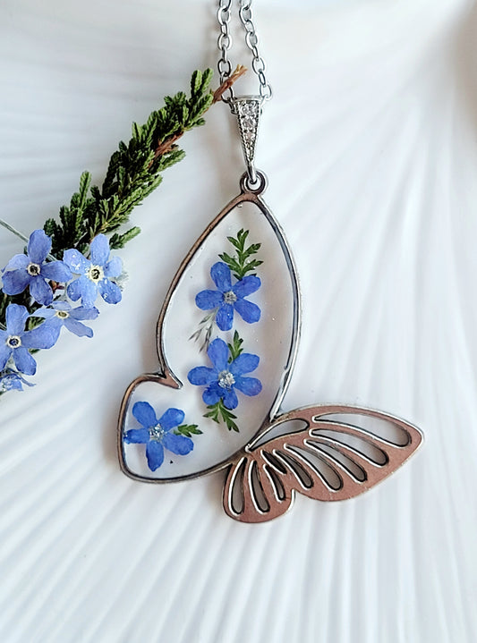 Butterfly necklace with foget me not flowers