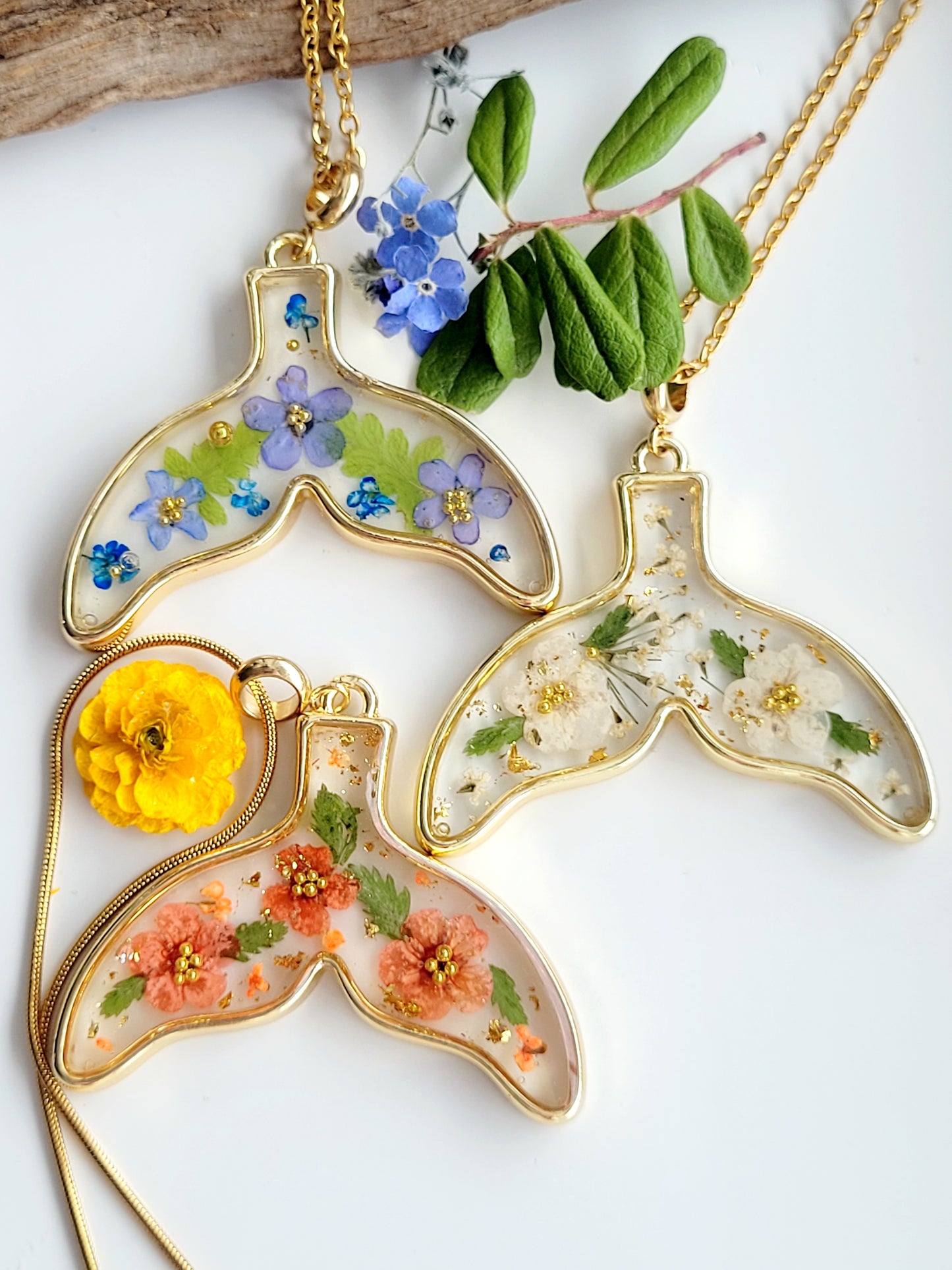 Botanical handcrafted whale tail necklace with genuine flowers