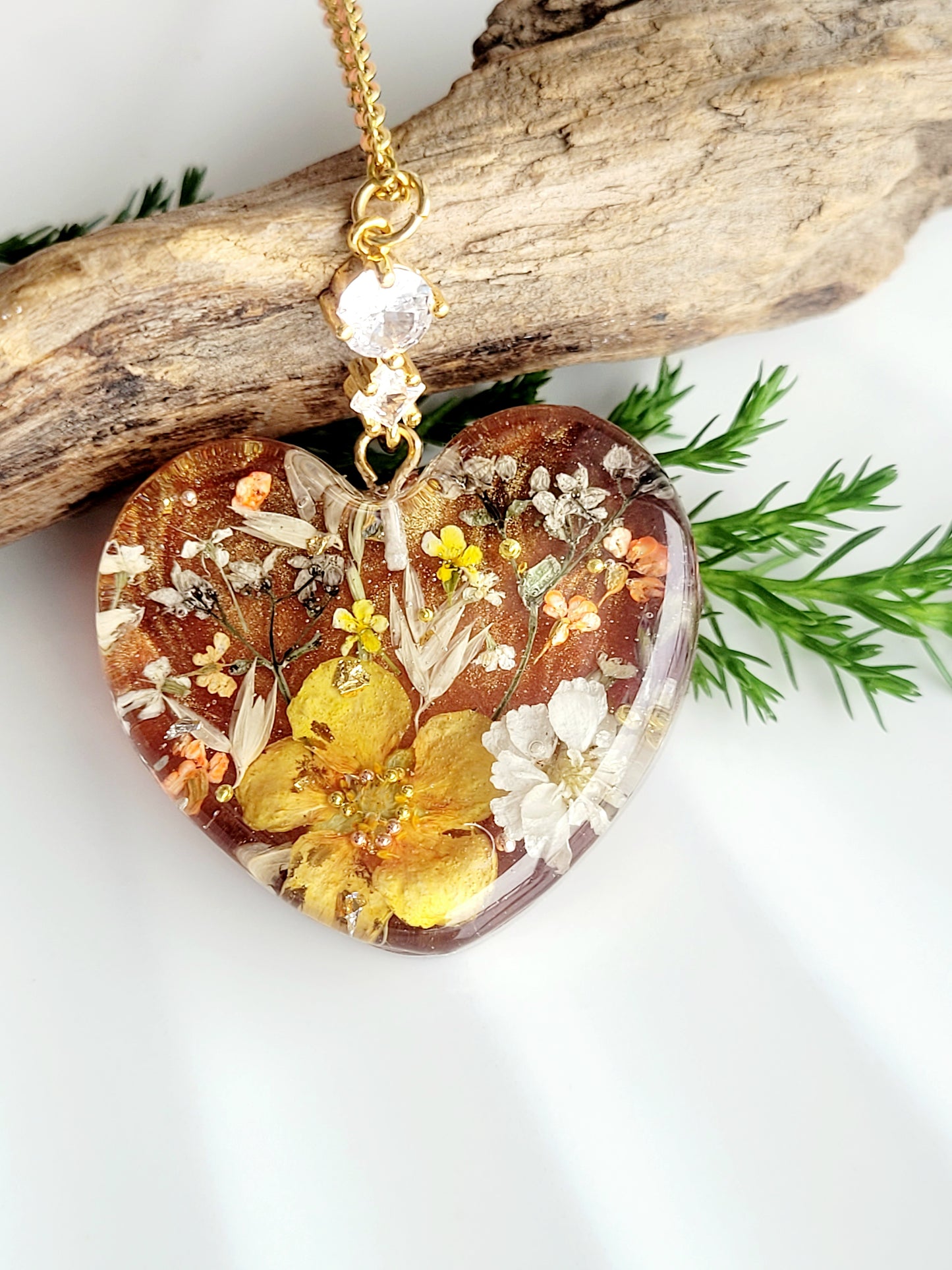 Amber like floral botanical handcrafted heart necklace with genuine flowers