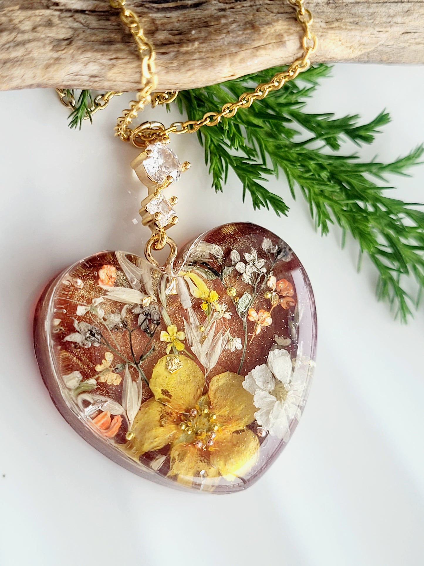 Amber like floral botanical handcrafted heart necklace with genuine flowers