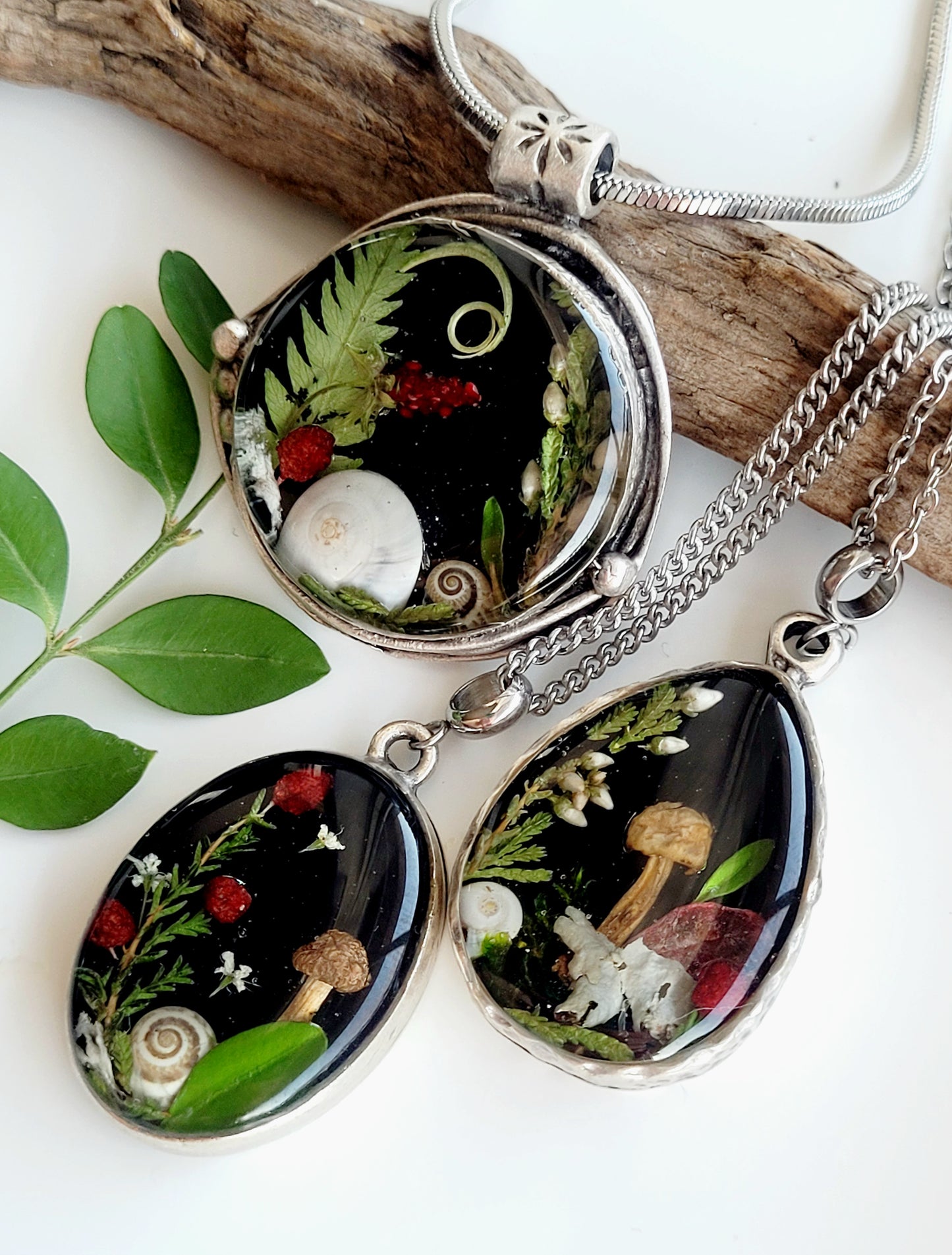 Round botanical handcrafted wld strawberry necklace.