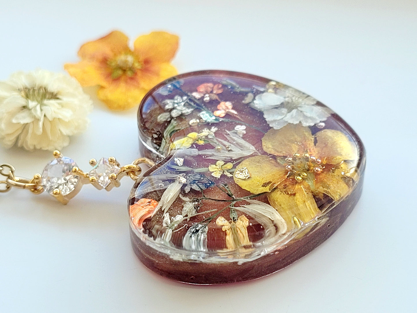 Amber like floral botanical handcrafted heart necklace with genuine flowers