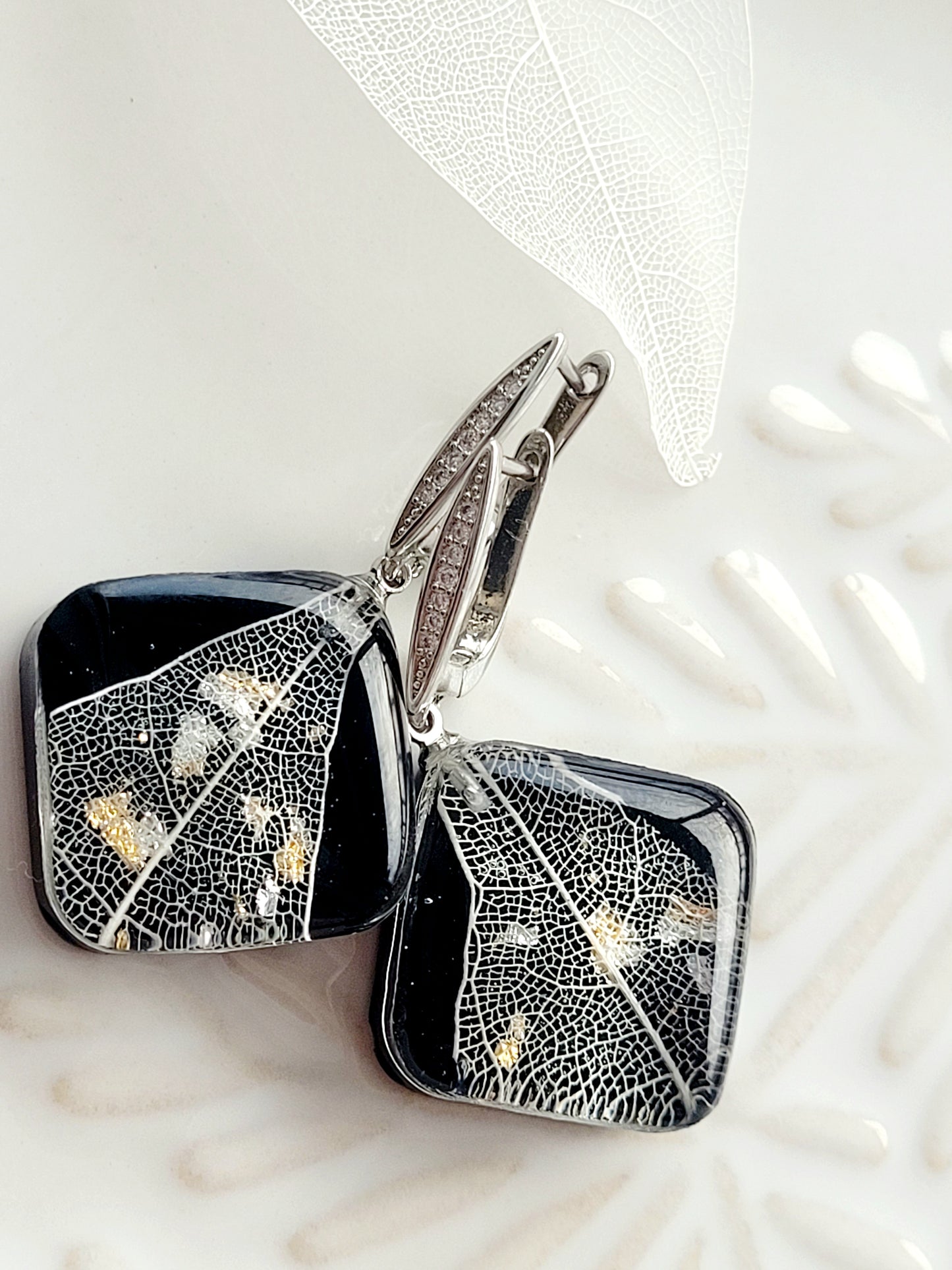 Handcrafted earrings with dried magnolia leaf. Elegant and stylish light handmade earrings